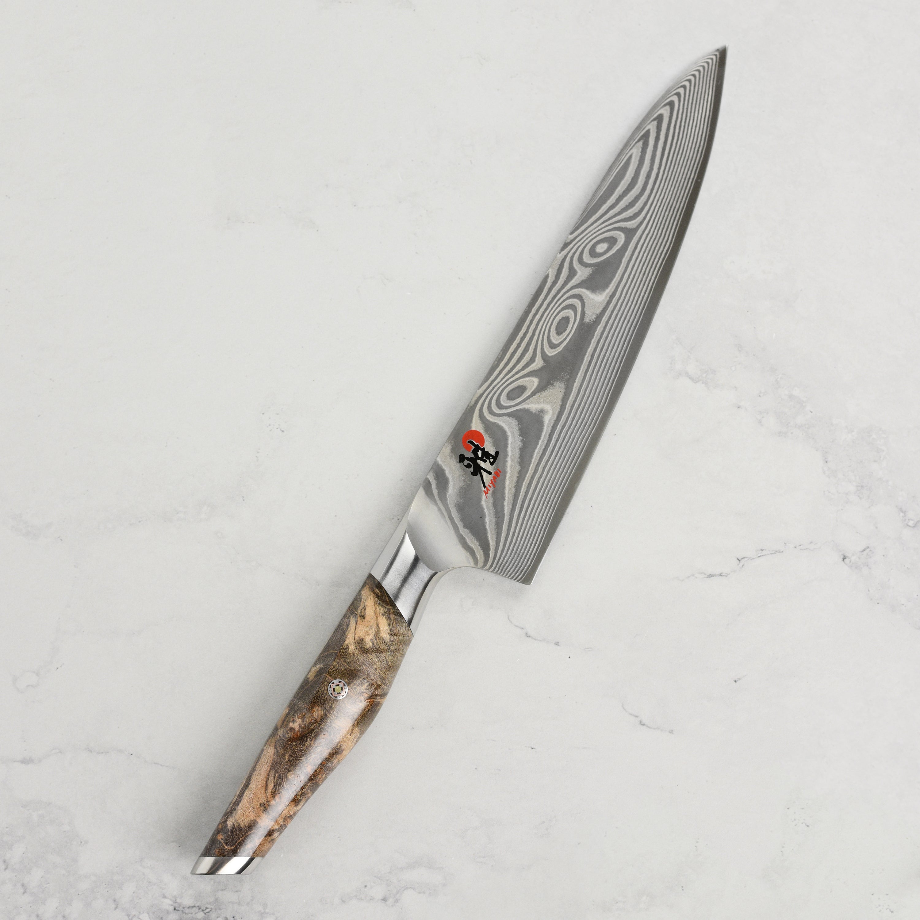Close-up of Miyabi Iki Damascus pattern on high-carbon chefs knife
