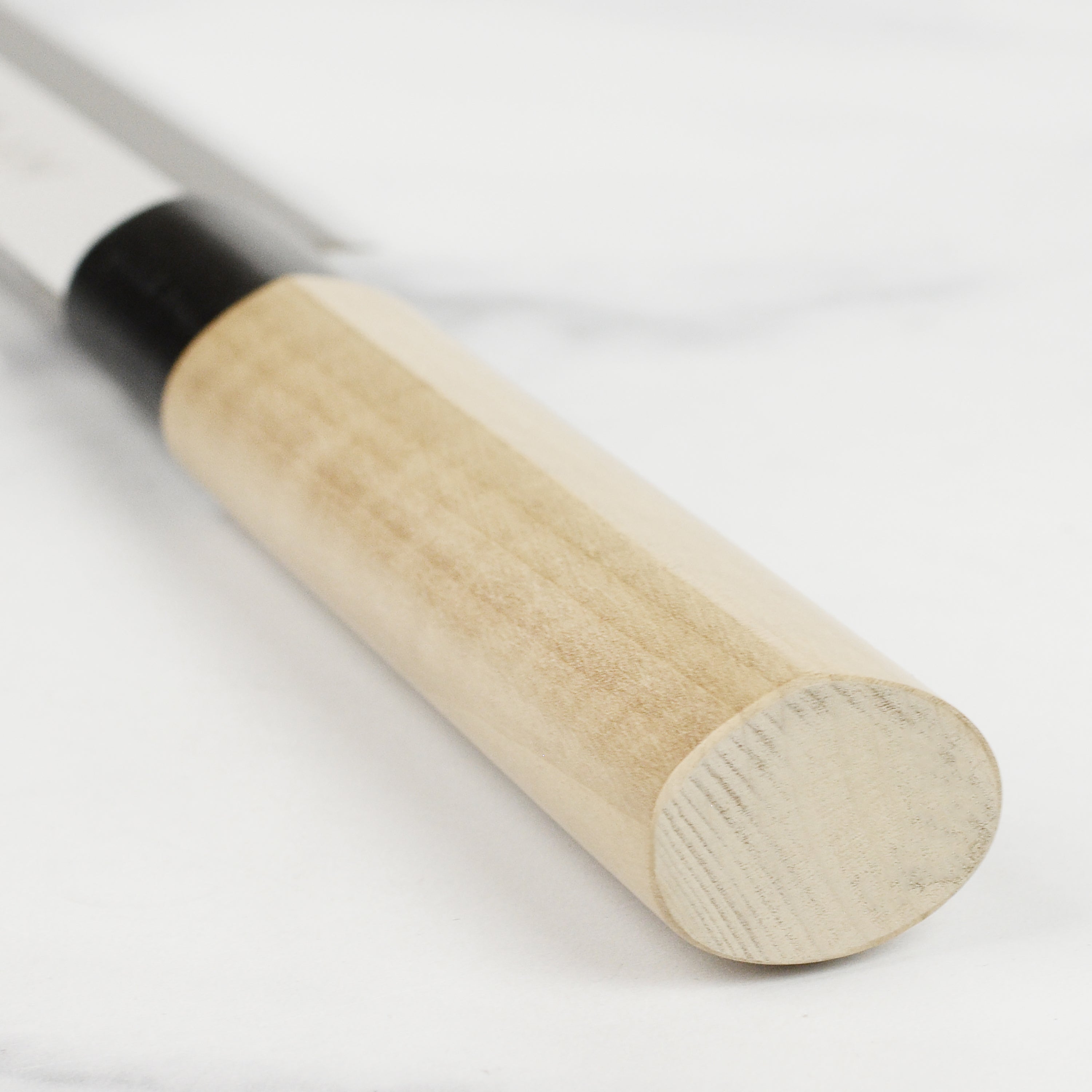Close-up of the Tojiro MV Yanagiba Knife highlighting the beautiful magnolia wood handle.