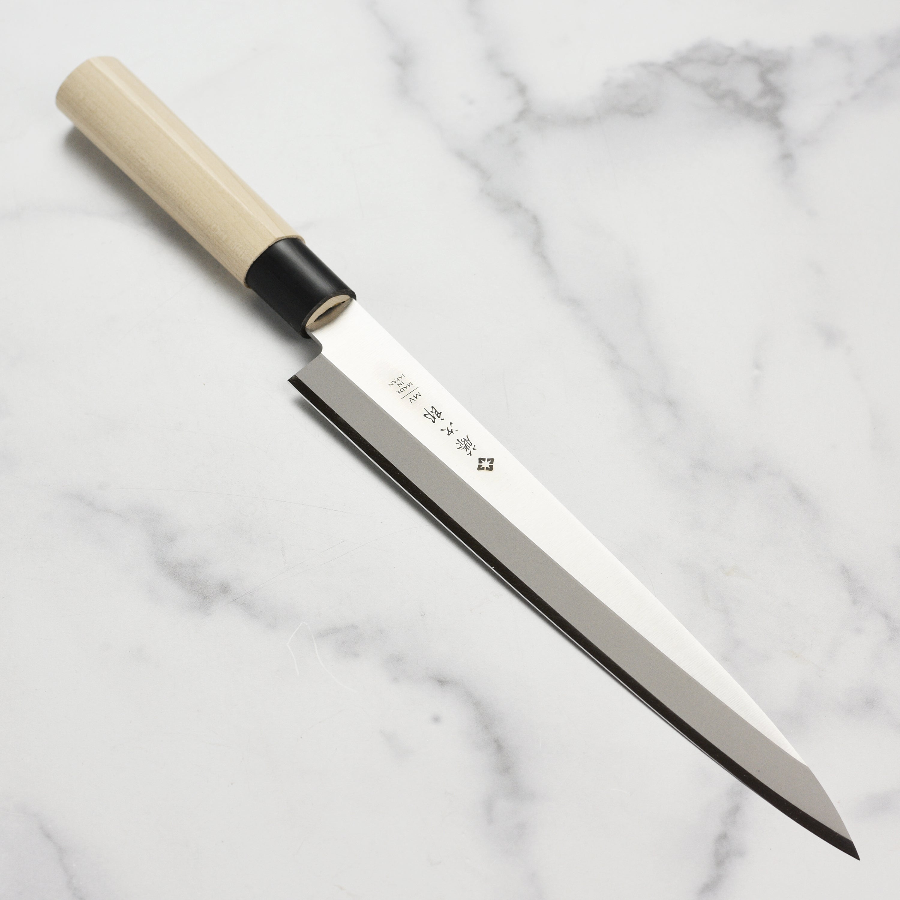 Tojiro MV Yanagiba Knife with sharp edge, perfect for sashimi and sushi preparation.
