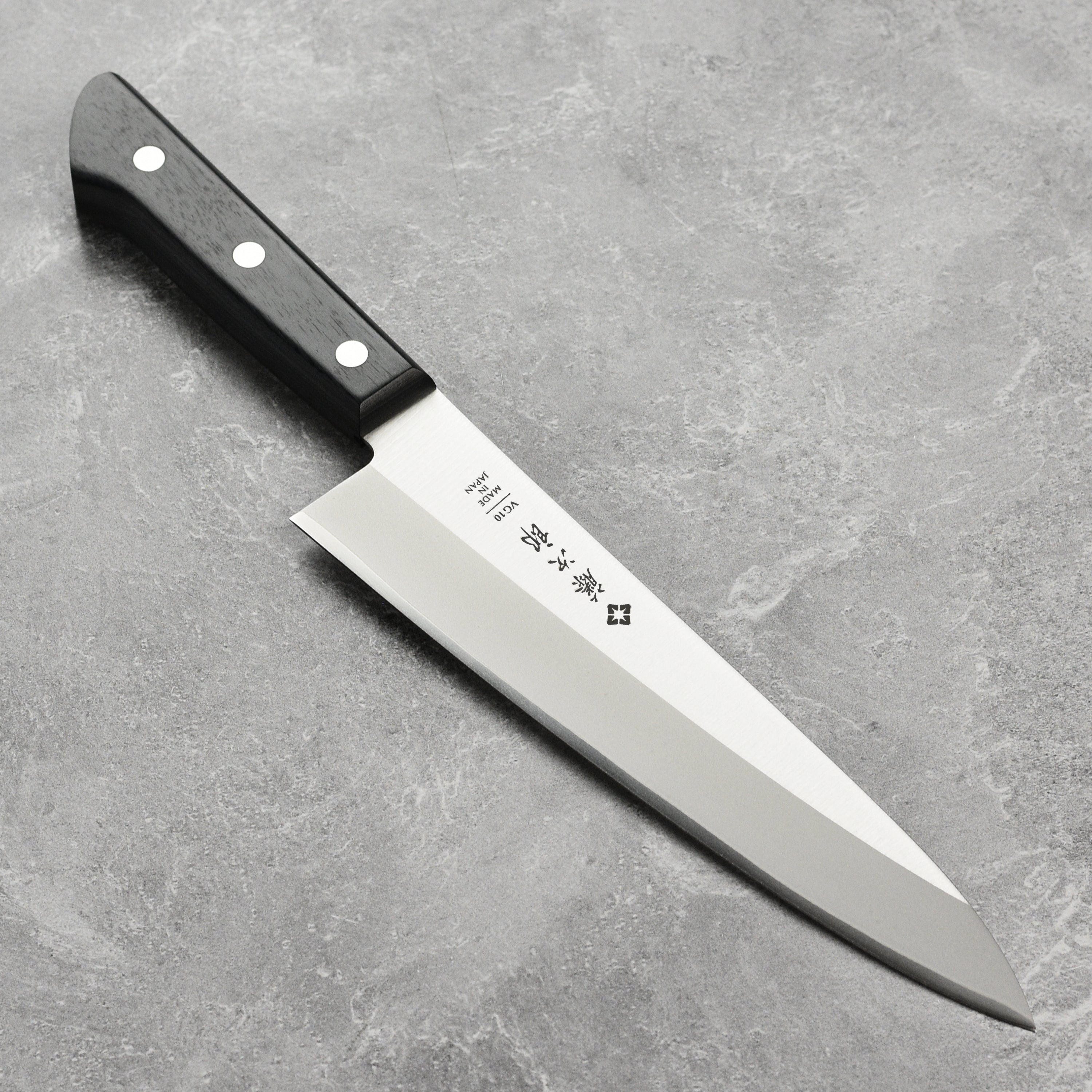 Side profile of the Tojiro VG-10 Elite 8-Inch Chef's Knife showing its double bevel edge and Japanese steel finish