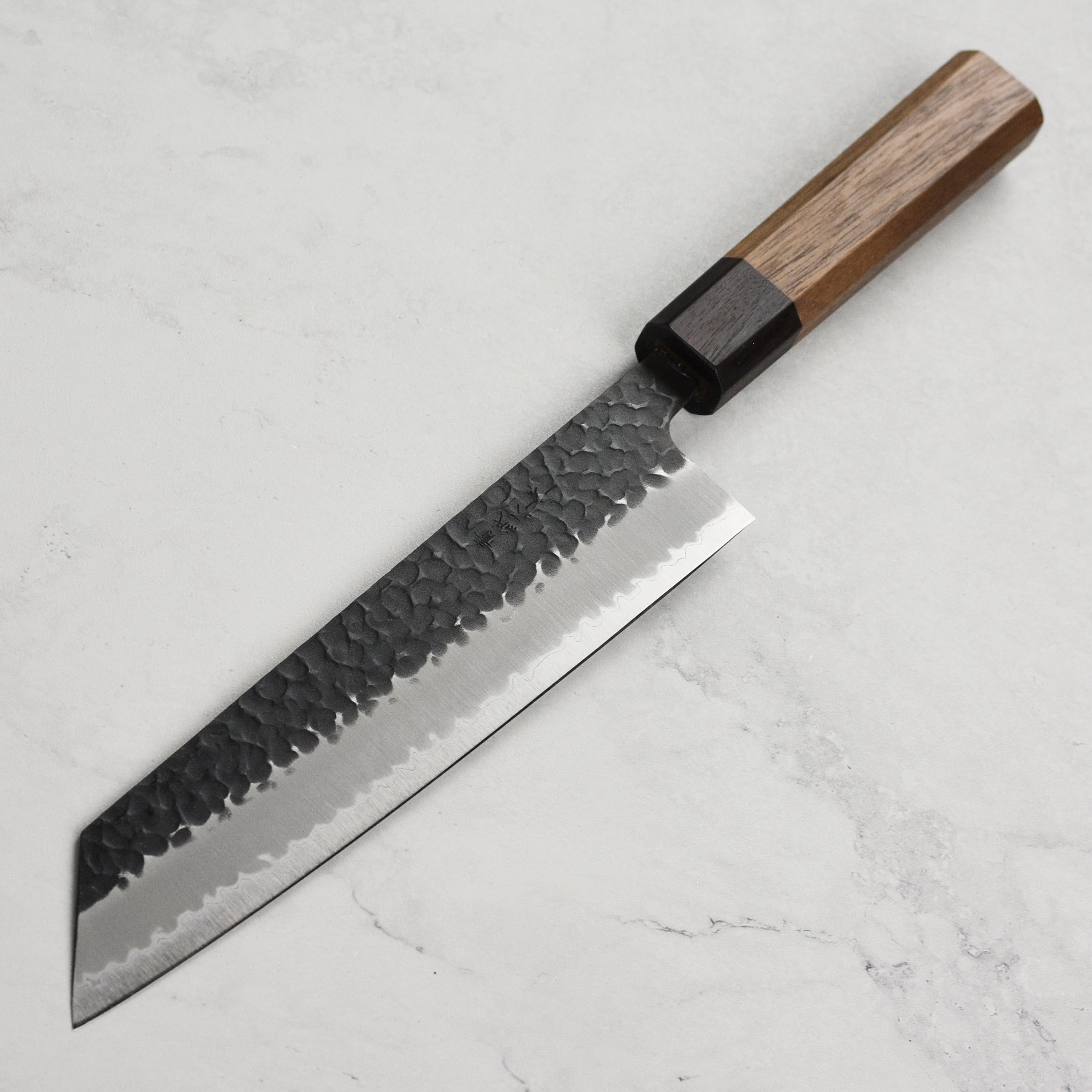 Close-up of the sharp edge and detailed craftsmanship of the Aogami super knife