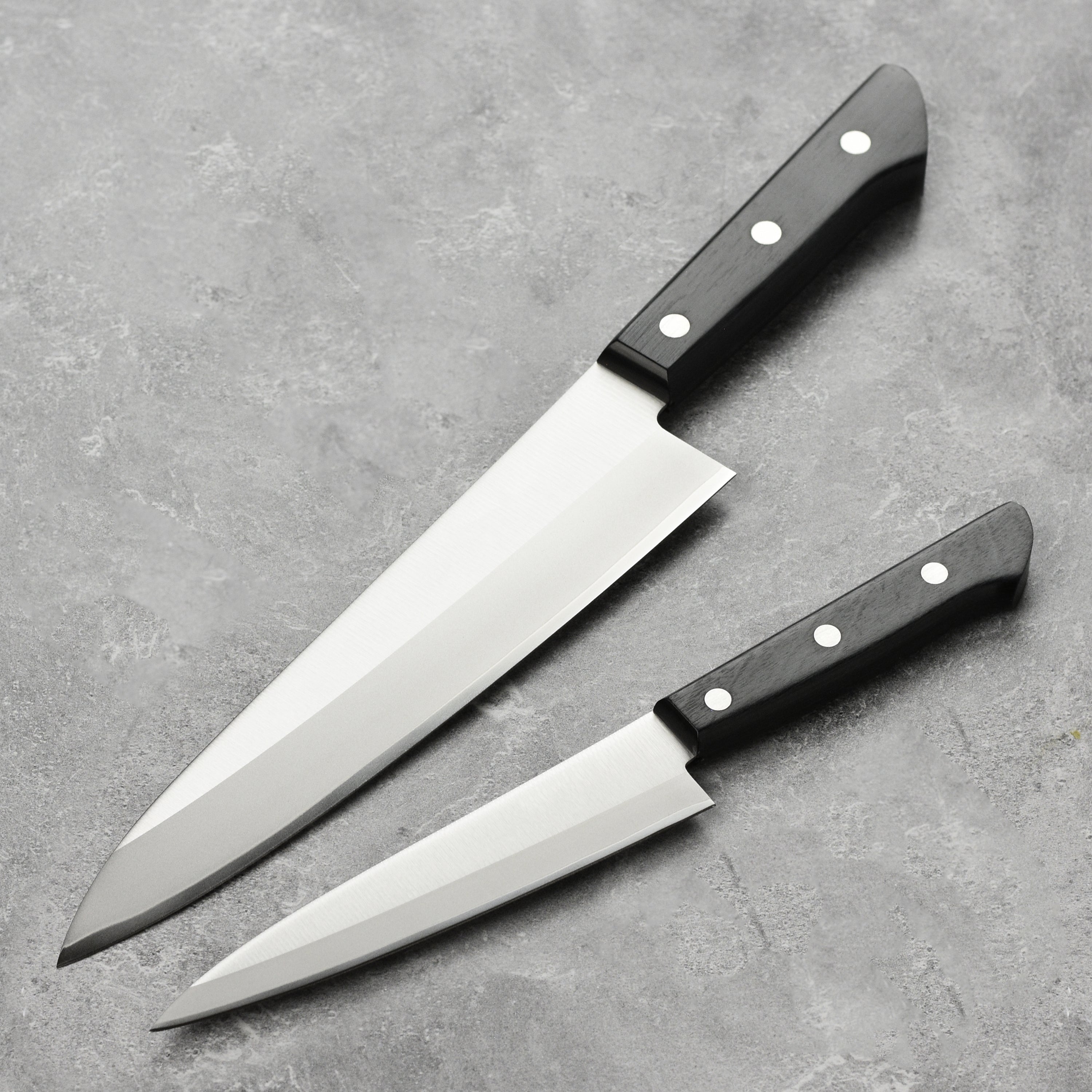 Tojiro knife set displayed in a modern kitchen setting, showcasing its sleek design.
