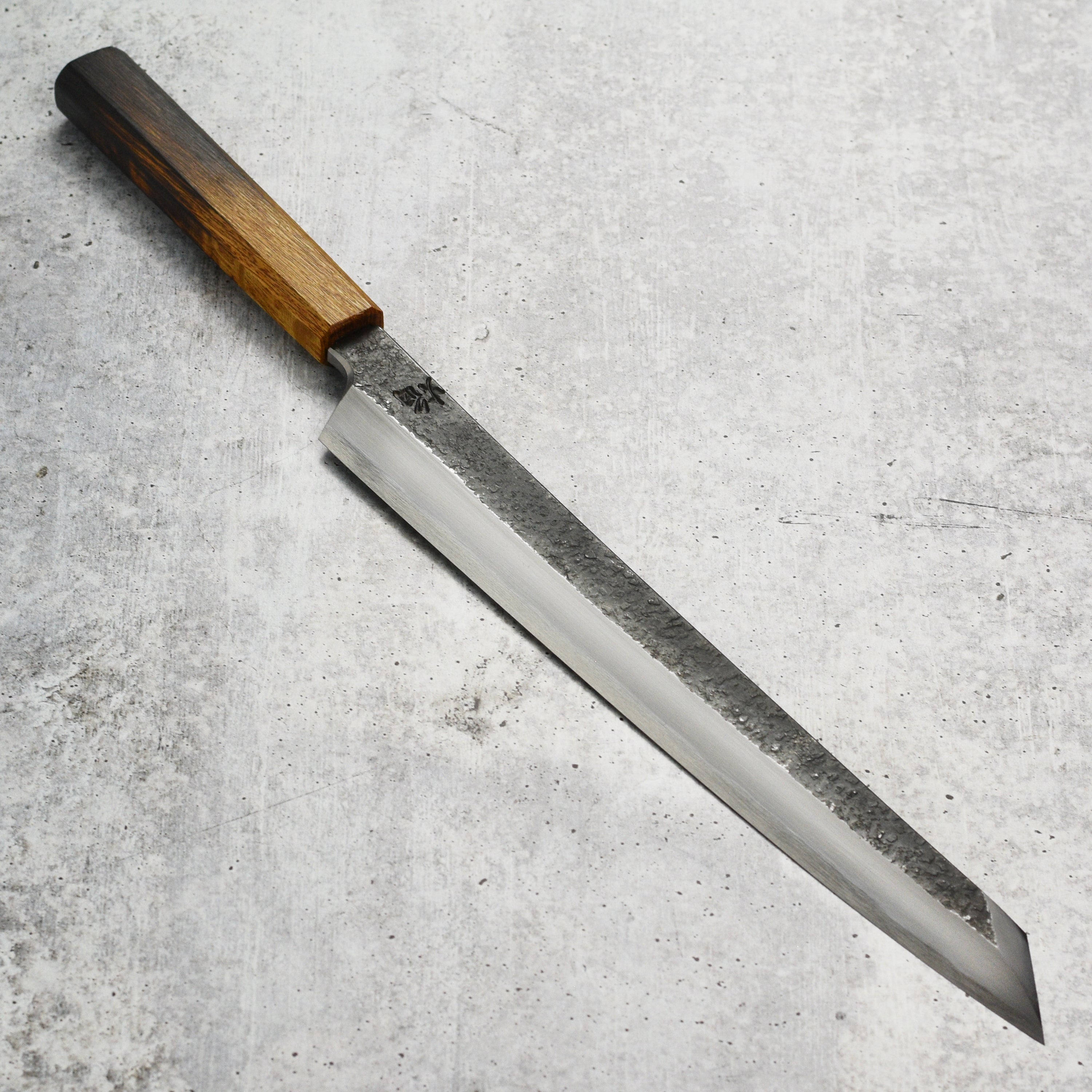 Takayuki Homura Guren Aogami #2 Yanagiba Knife from above, showcasing its sharp blade and elegant design.