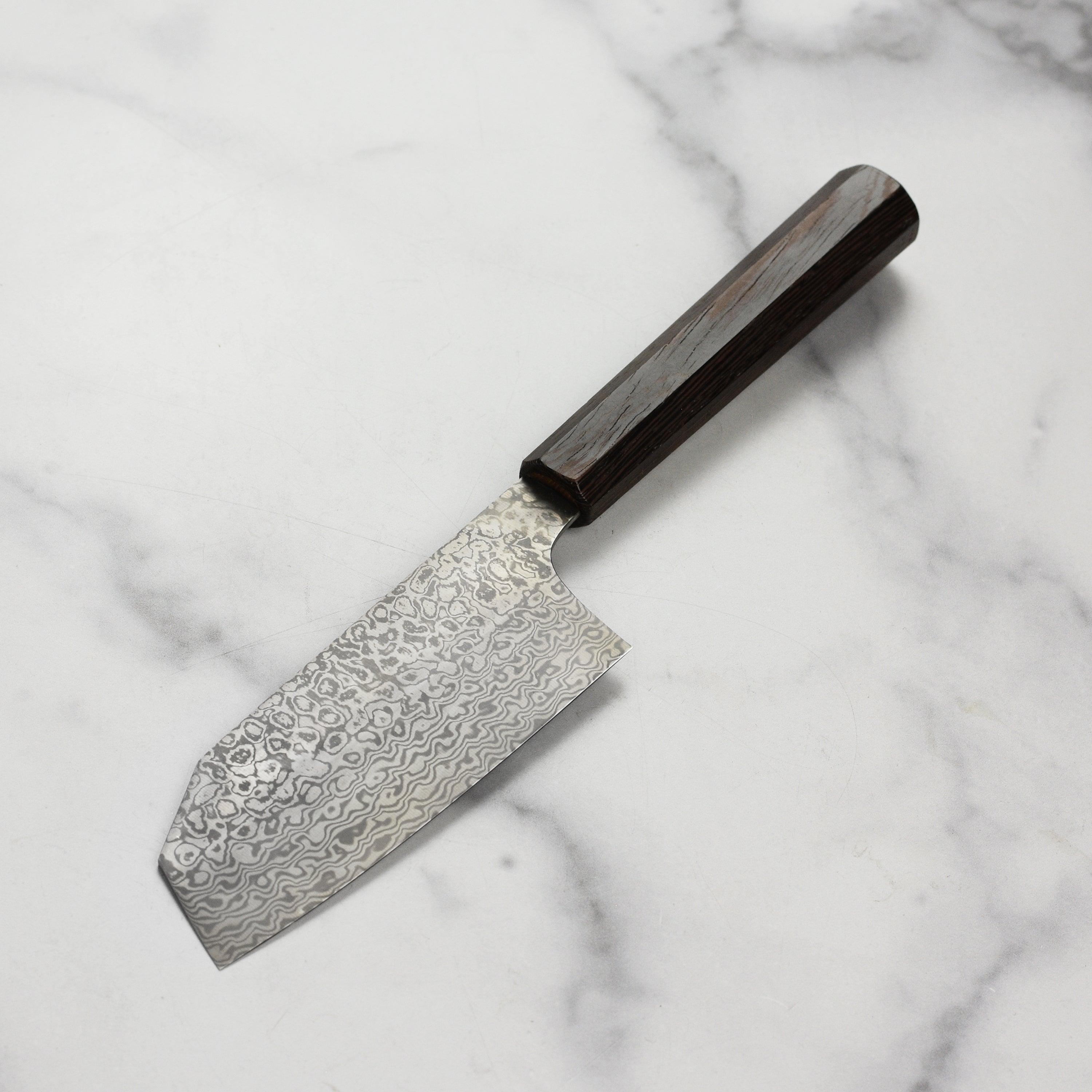 Ergonomic handle of Takayuki bunka knife for comfortable grip during prep