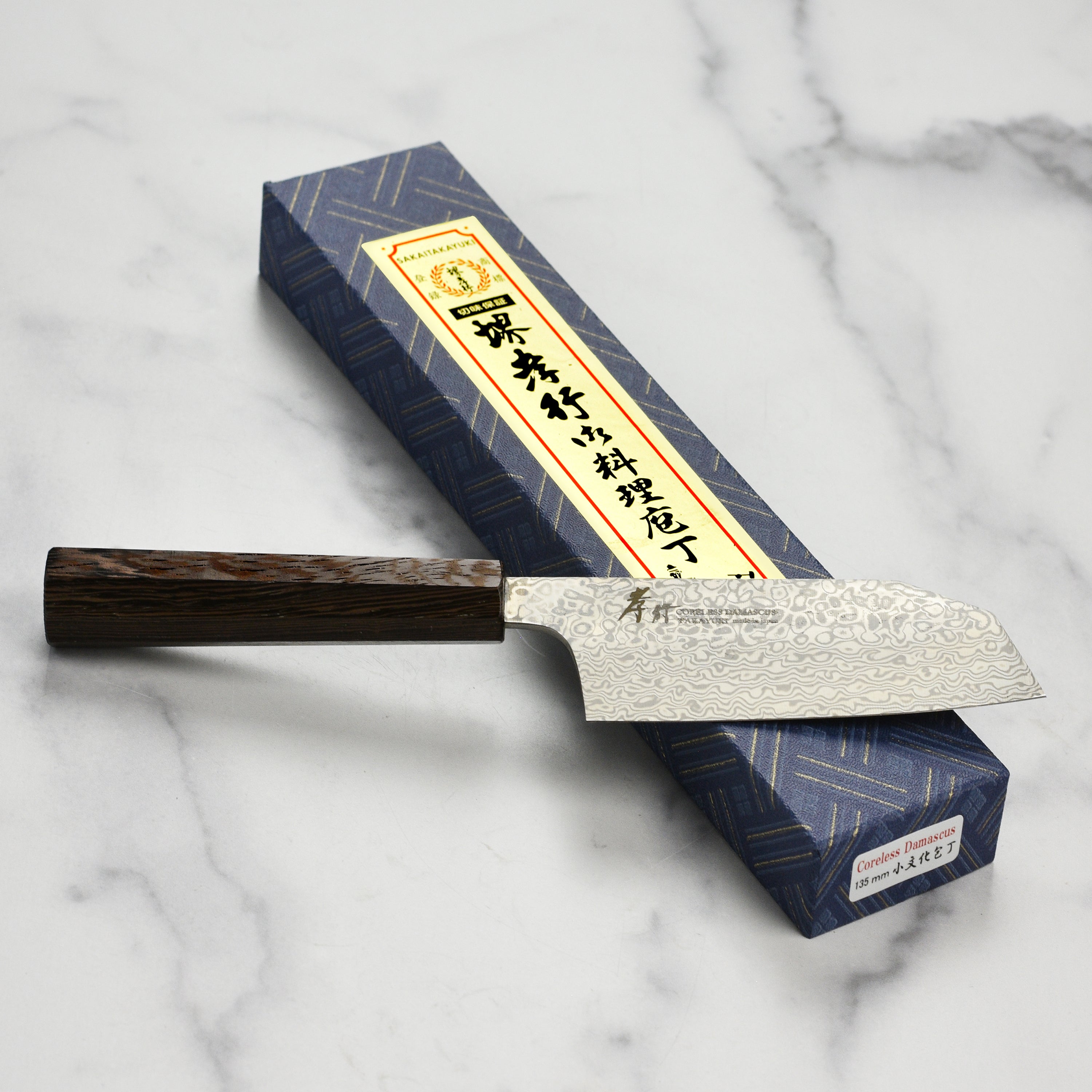 Ergonomic handle of Takayuki bunka knife for comfortable grip during prep