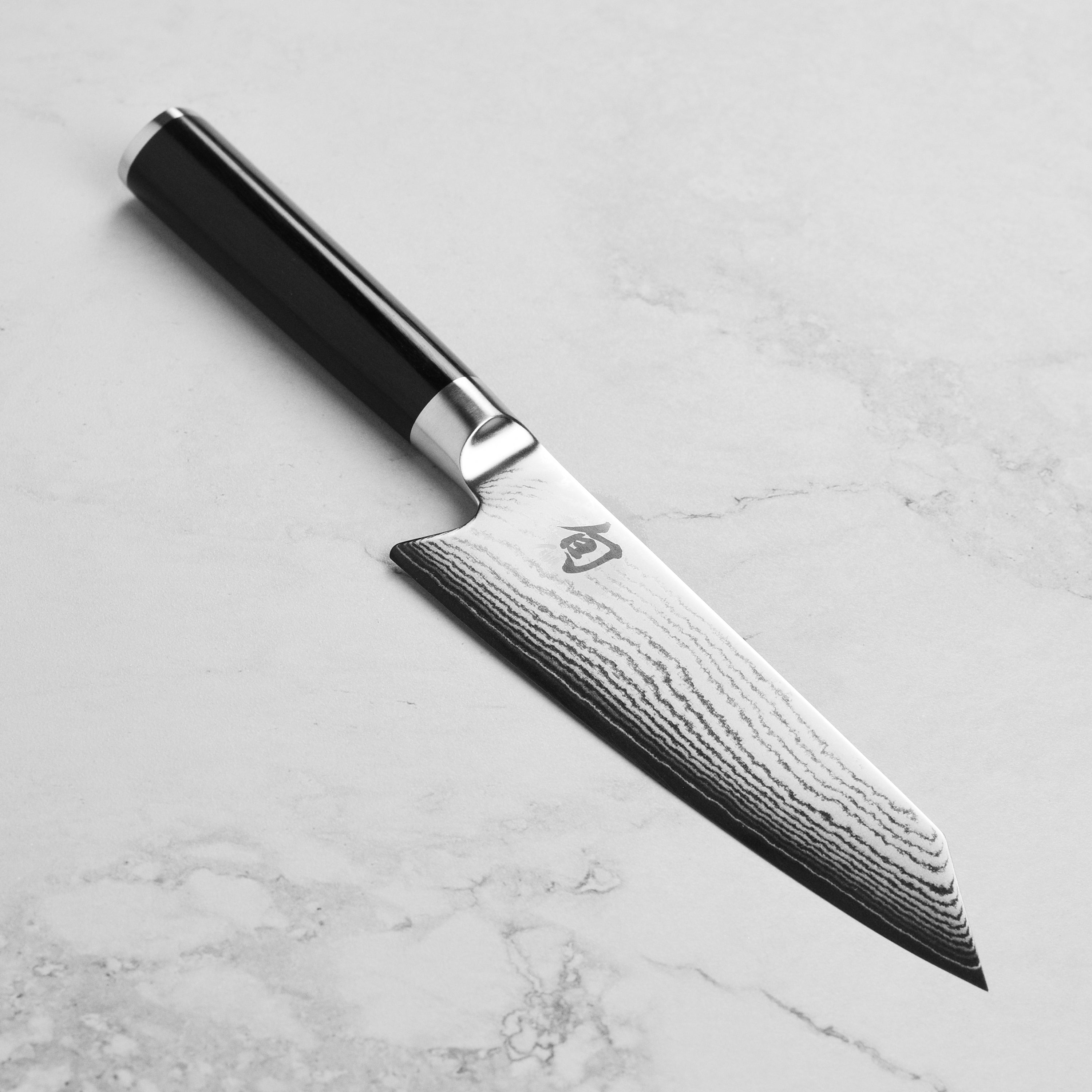 Close-up of the blade of the Premium 6-Inch Handcrafted Japanese Bunka Knife showcasing its Damascus pattern.