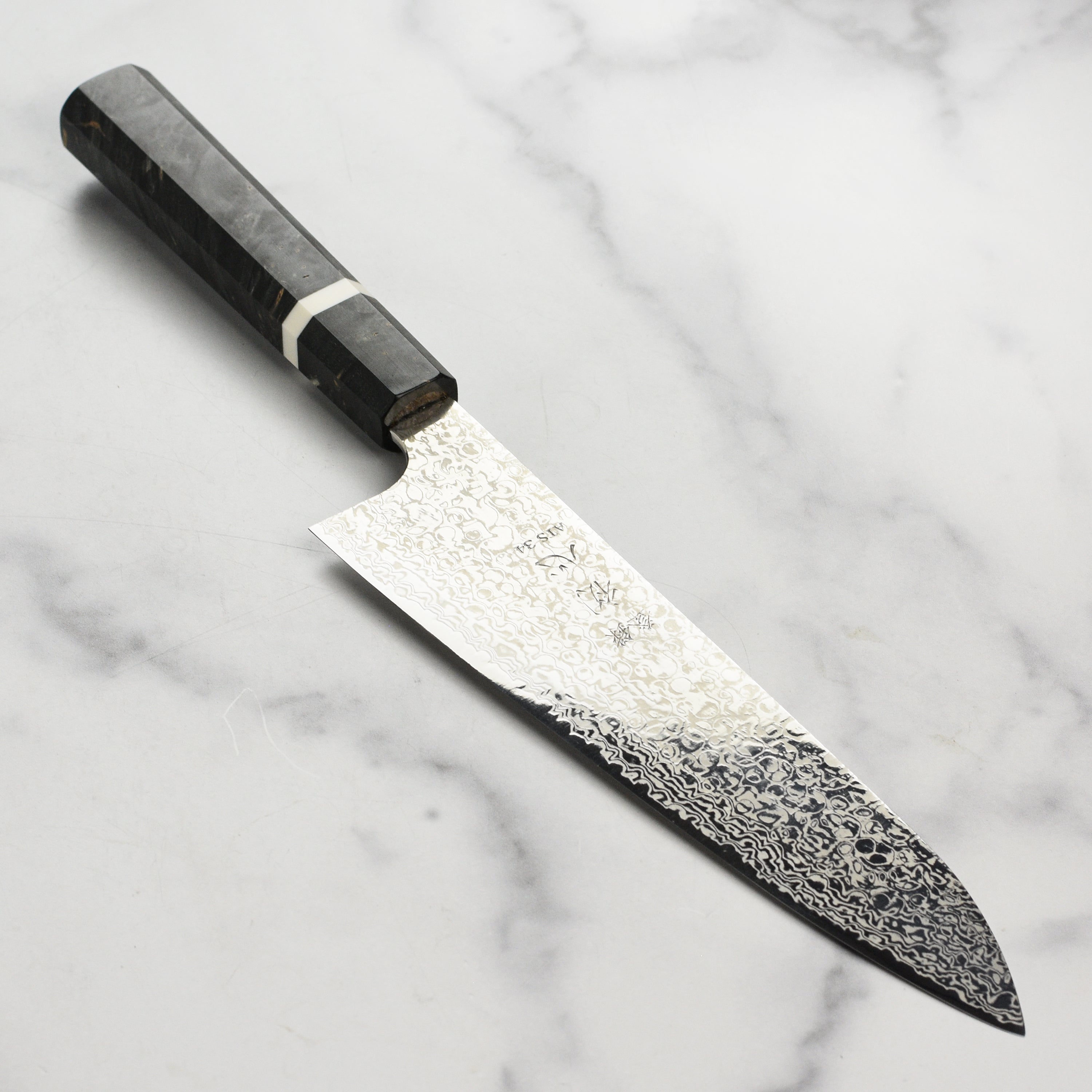 Hatsukokoro x Yauji Damascus gyuto knife blade close-up showing detailed Damascus pattern