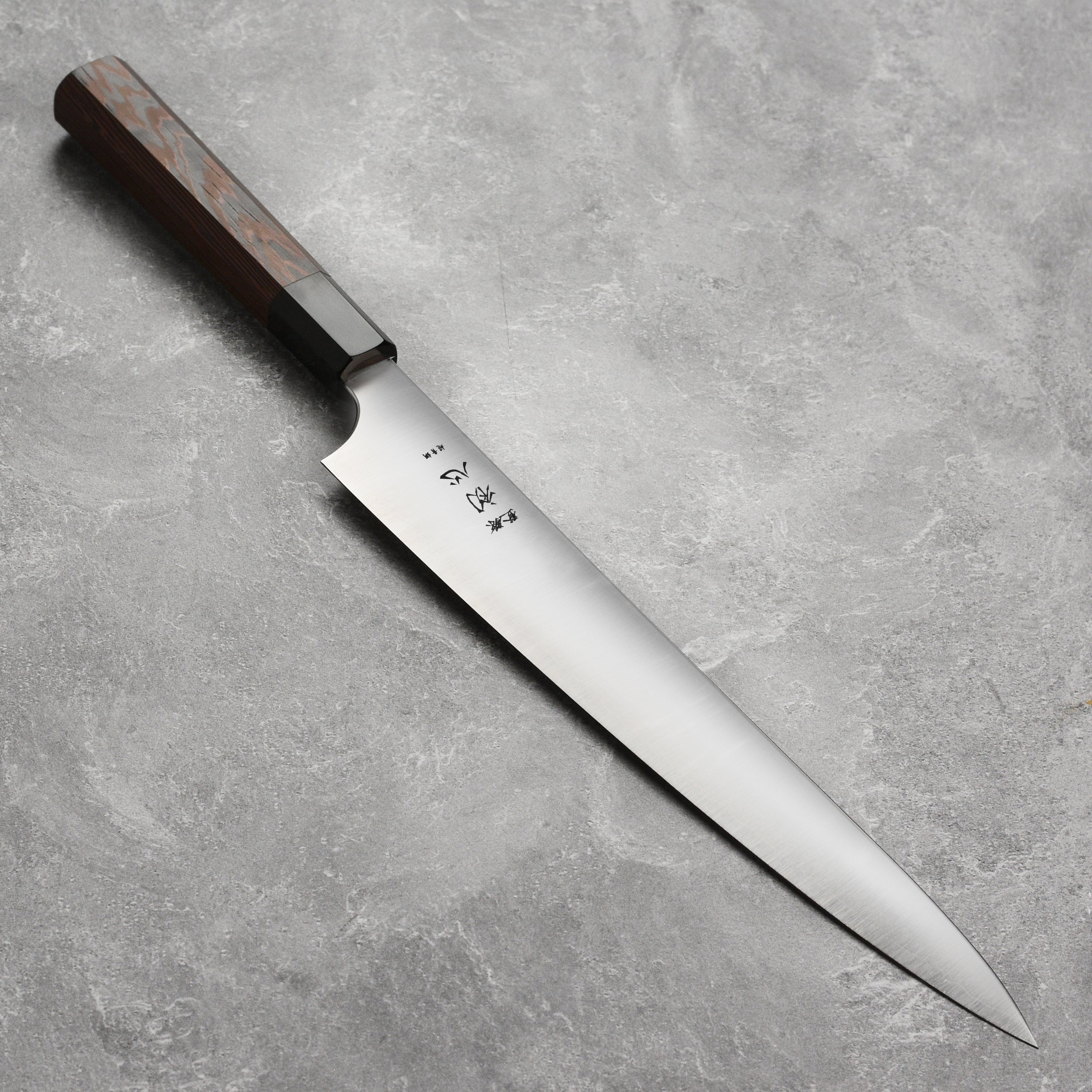 Hatsukokoro Hayabusa Aogami Sujihiki Knife showcasing its sharp blade and elegant handle.