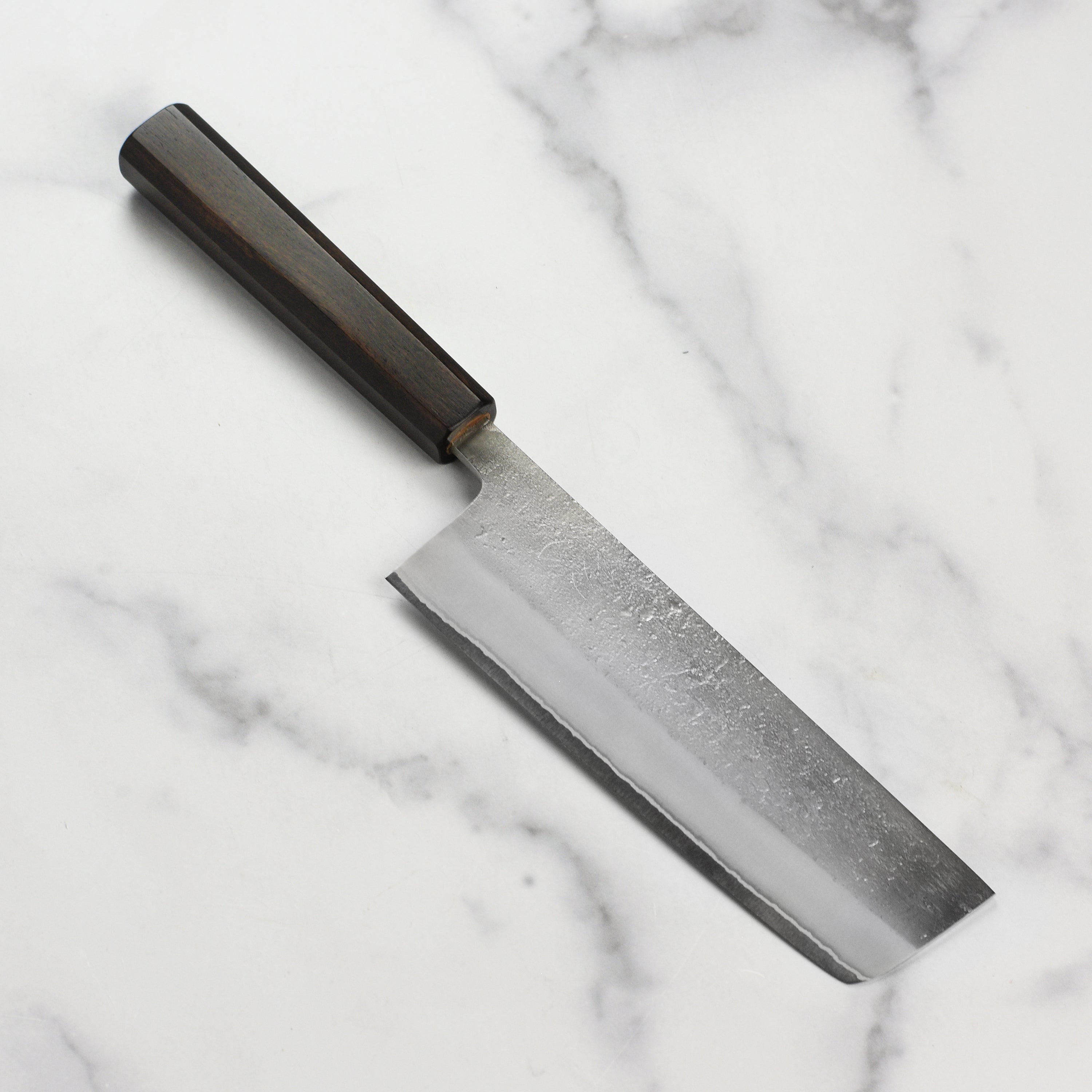 Yoshikane Shirogami #2 Nakiri Knife with stainless steel blade, ideal for slicing vegetables.