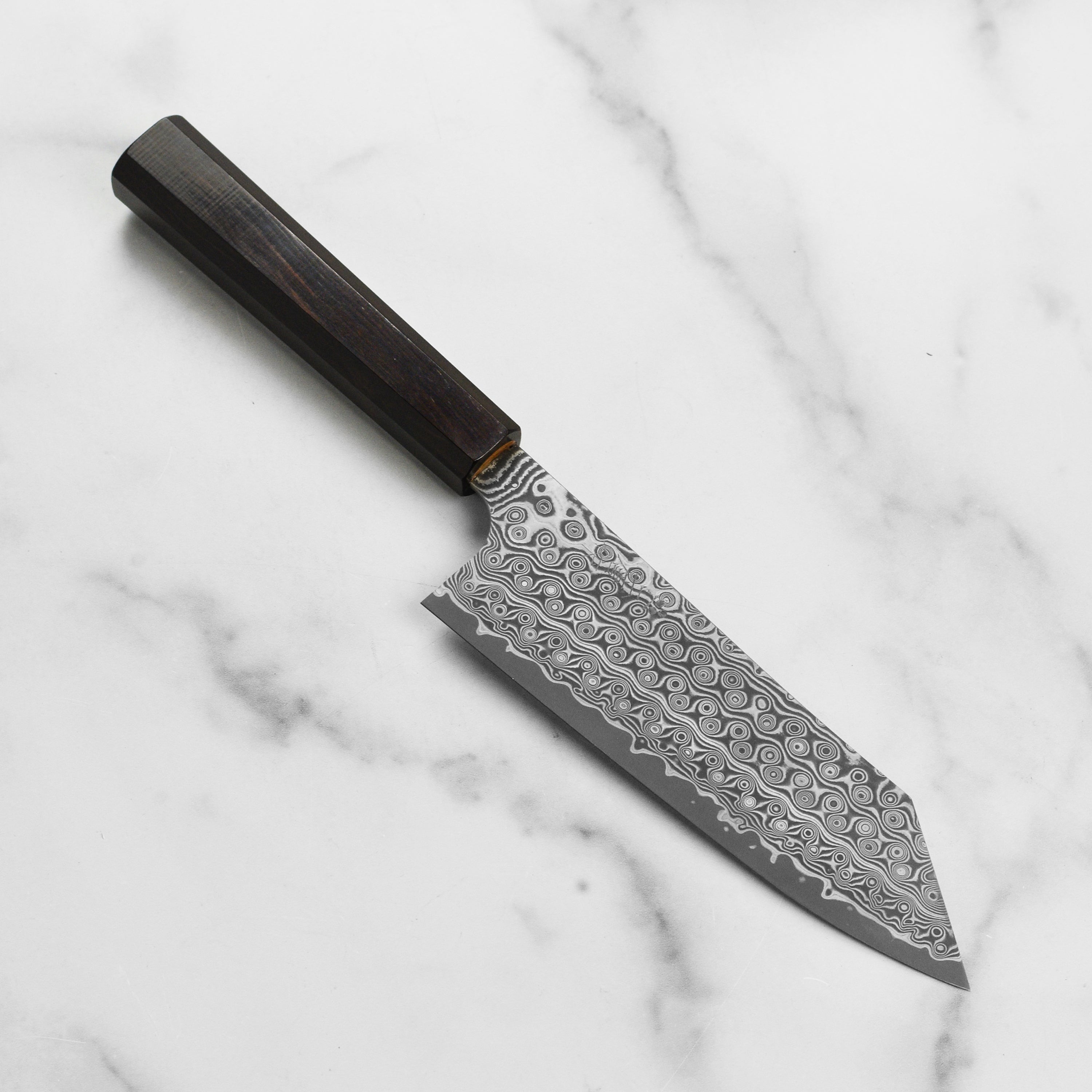 Close-up view of the 7-inch Damascus bunka knife showcasing its intricate blade design.