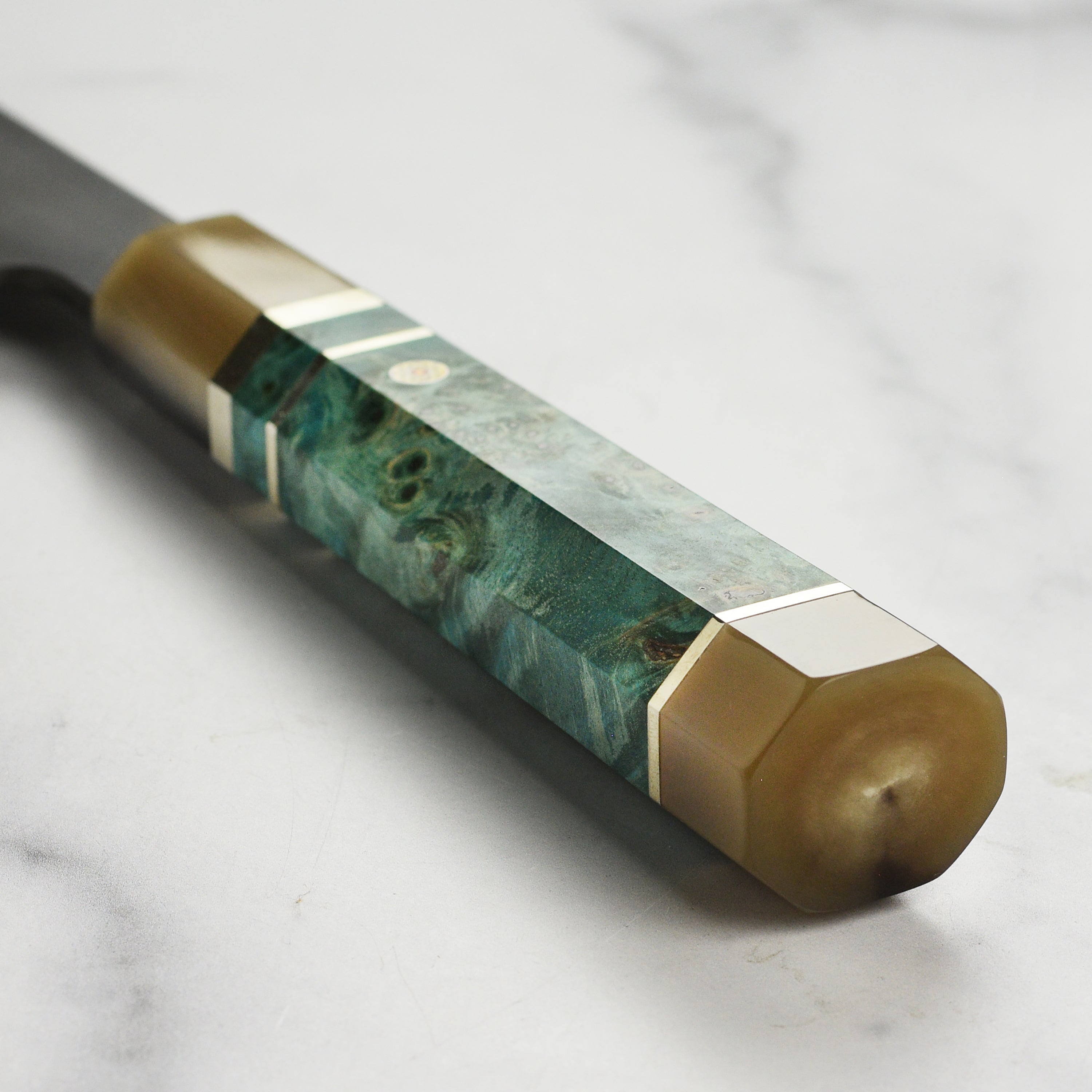 Japanese chef knife in action slicing vegetables on a cutting board