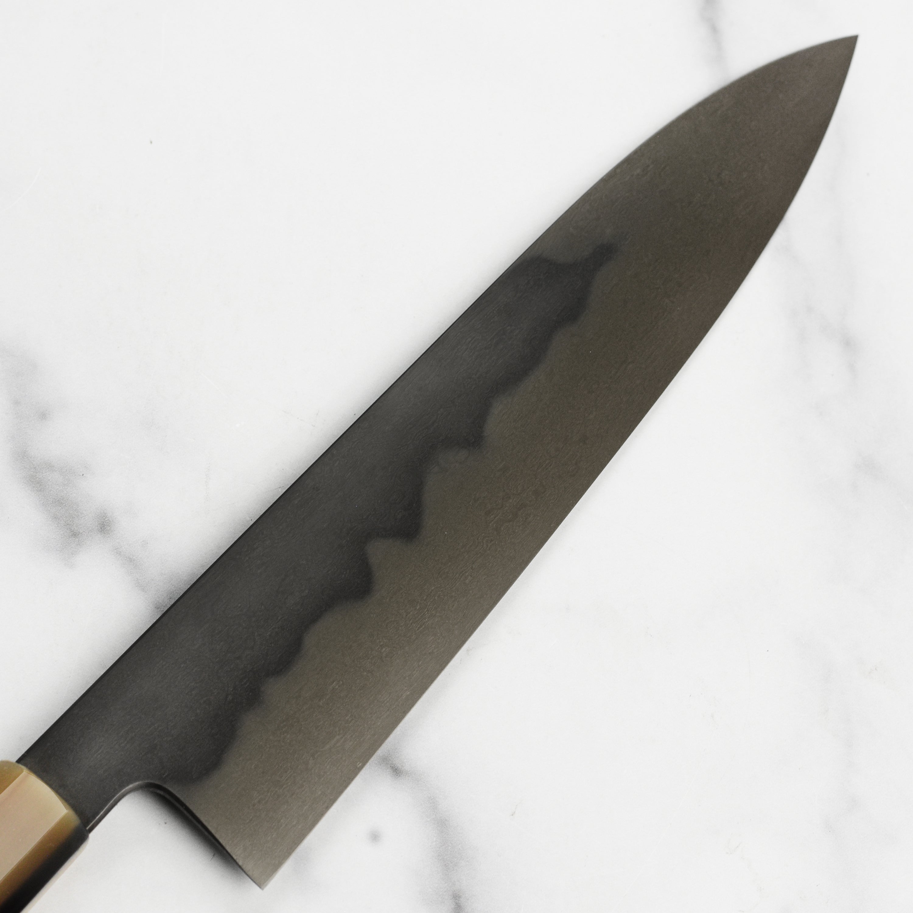 Close-up of the sharp edge of a Shirogami #1 Honyaki Gyuto for home and professional use
