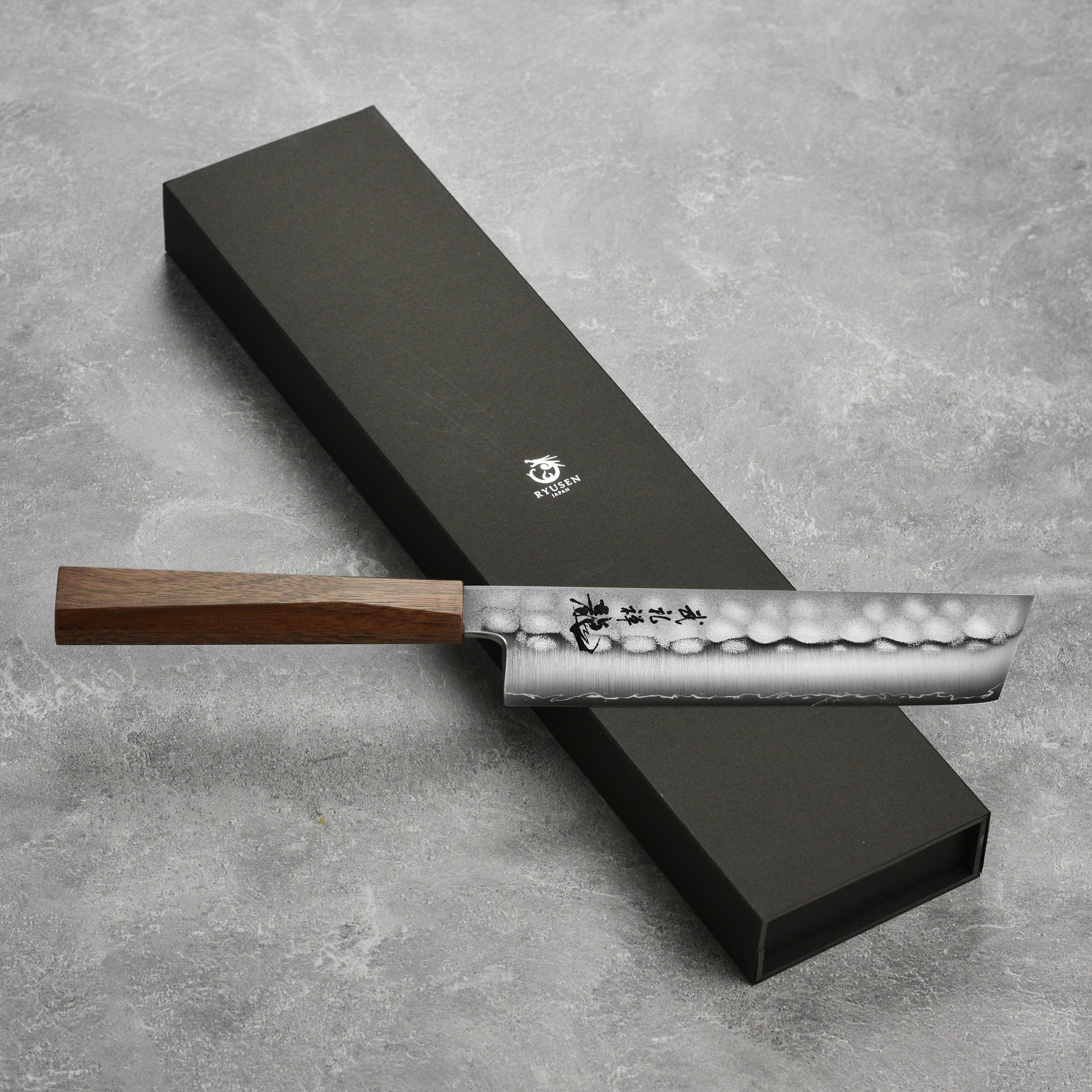 Close-up of the sharp edge of the Ryusen Blazen Ryu Wa SG2 Nakiri, perfect for home chefs and professional cooks