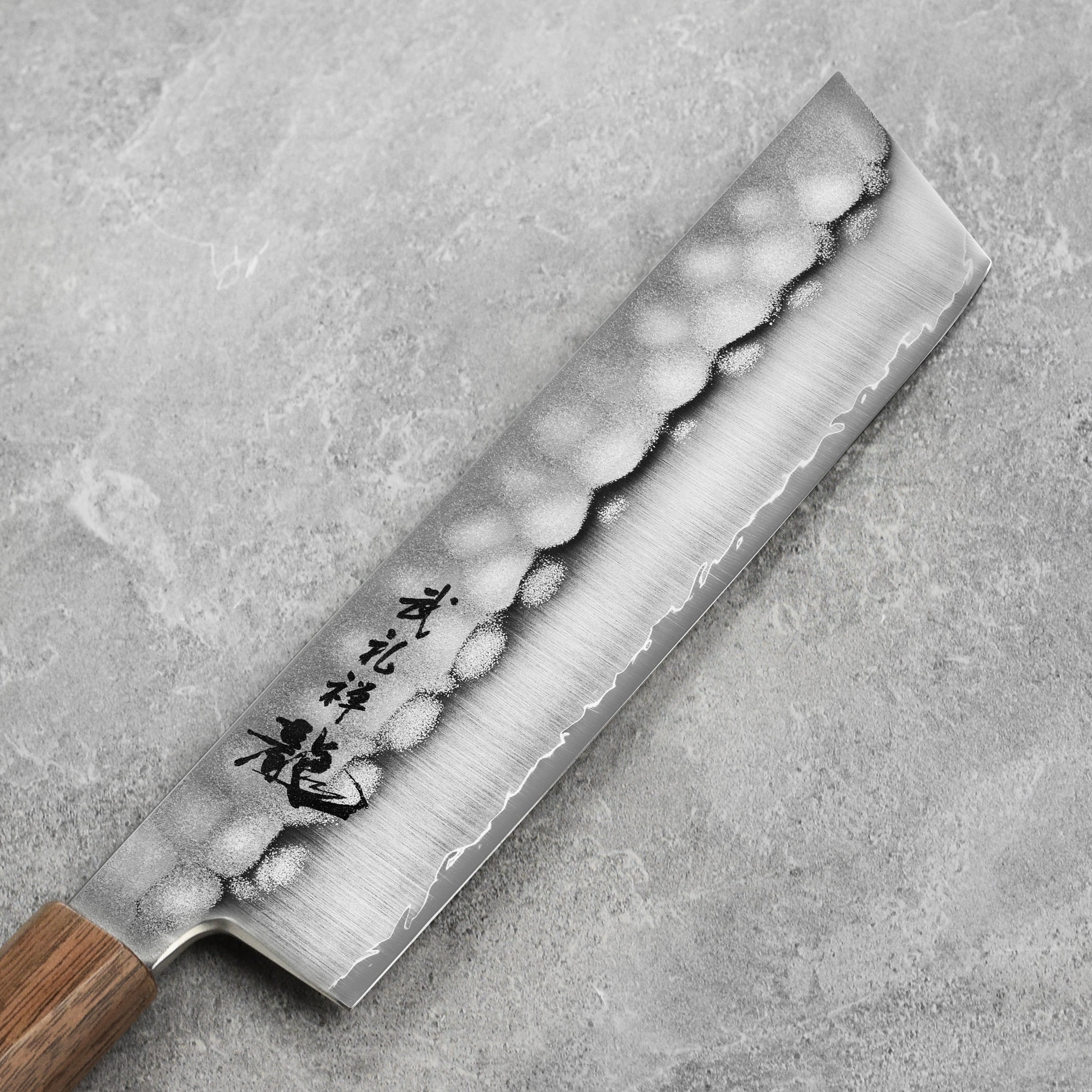 Close-up of the sharp edge of the Ryusen Blazen Ryu Wa SG2 Nakiri, perfect for home chefs and professional cooks