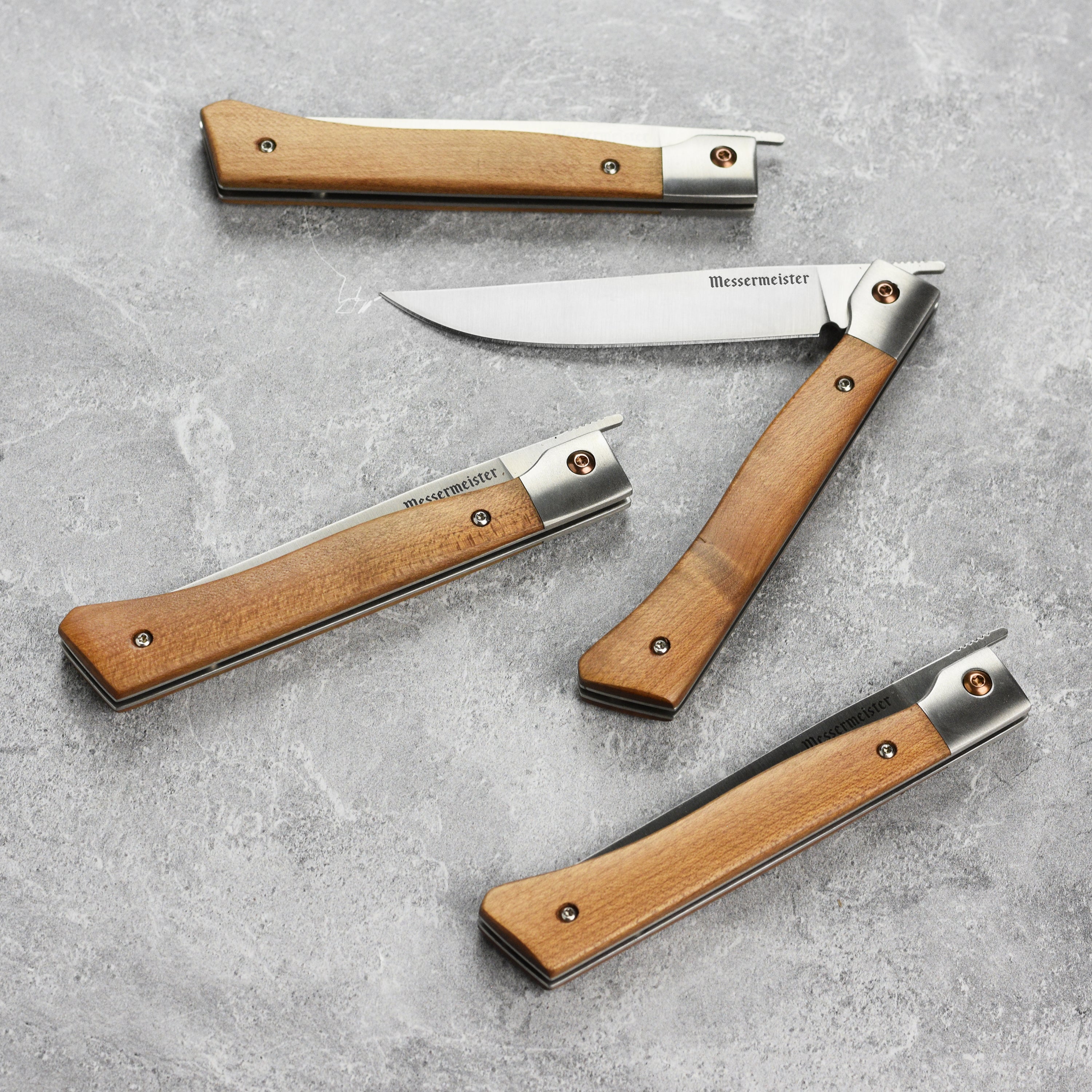 Close-up of the open frame handle and liner locking mechanism on steak knives