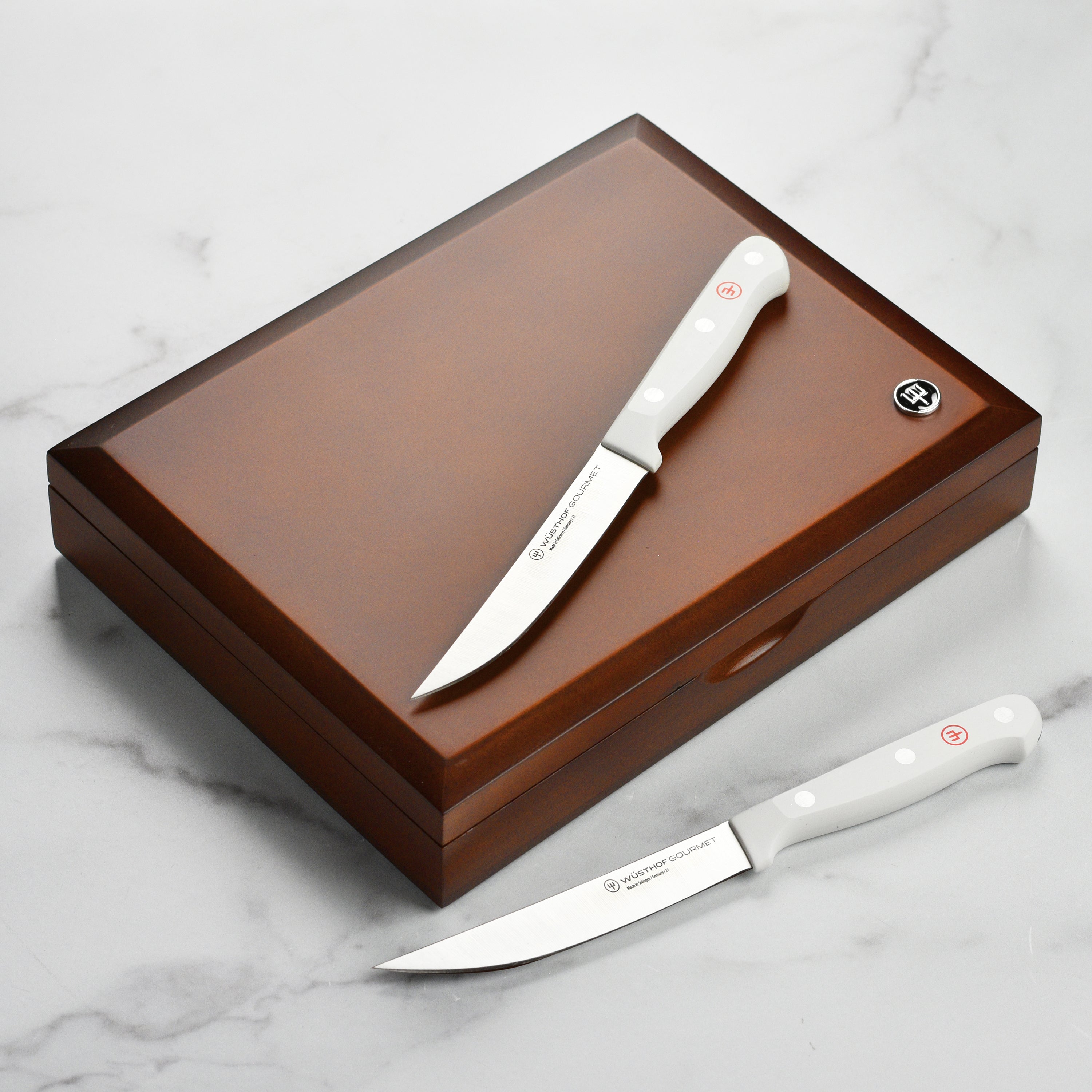 Set of 8 Wusthof steak knives with case, showing sharp blades and durable handles