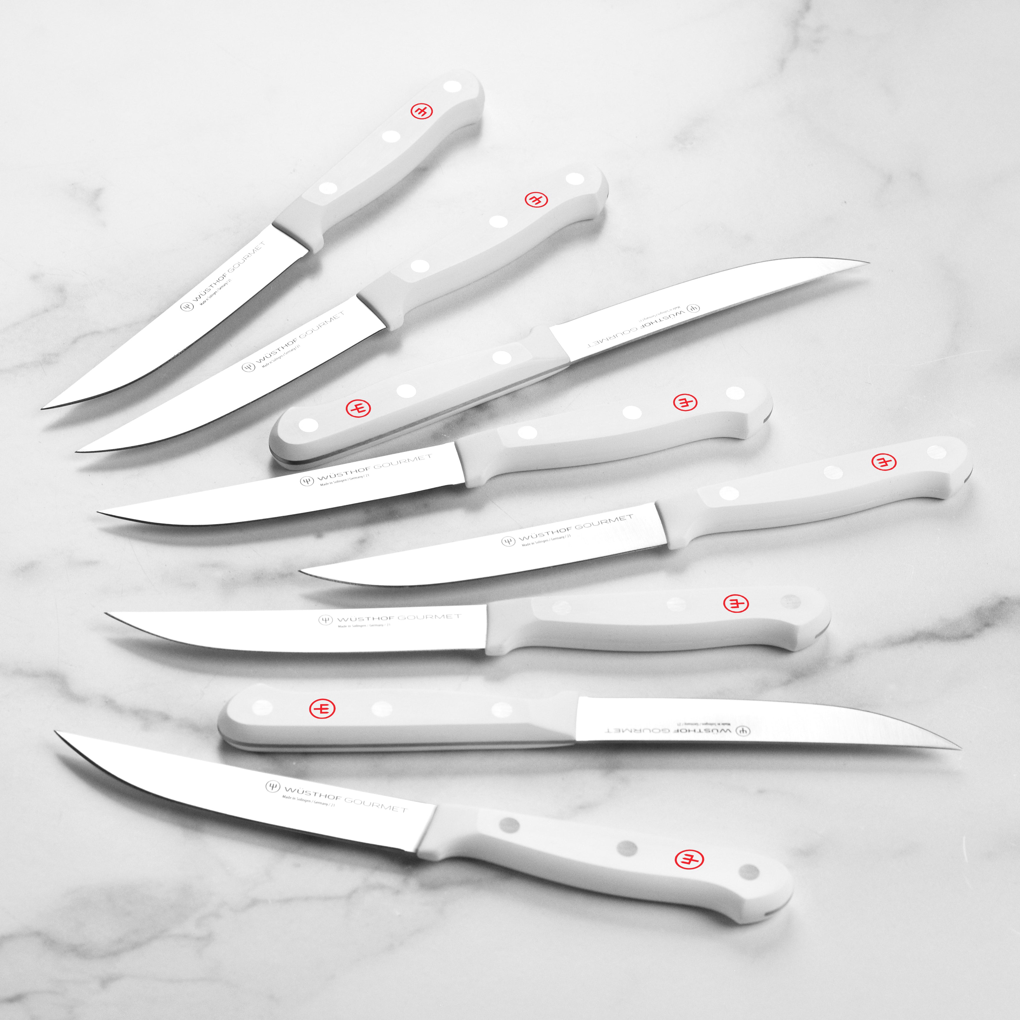 Set of 8 Wusthof steak knives with case, showing sharp blades and durable handles