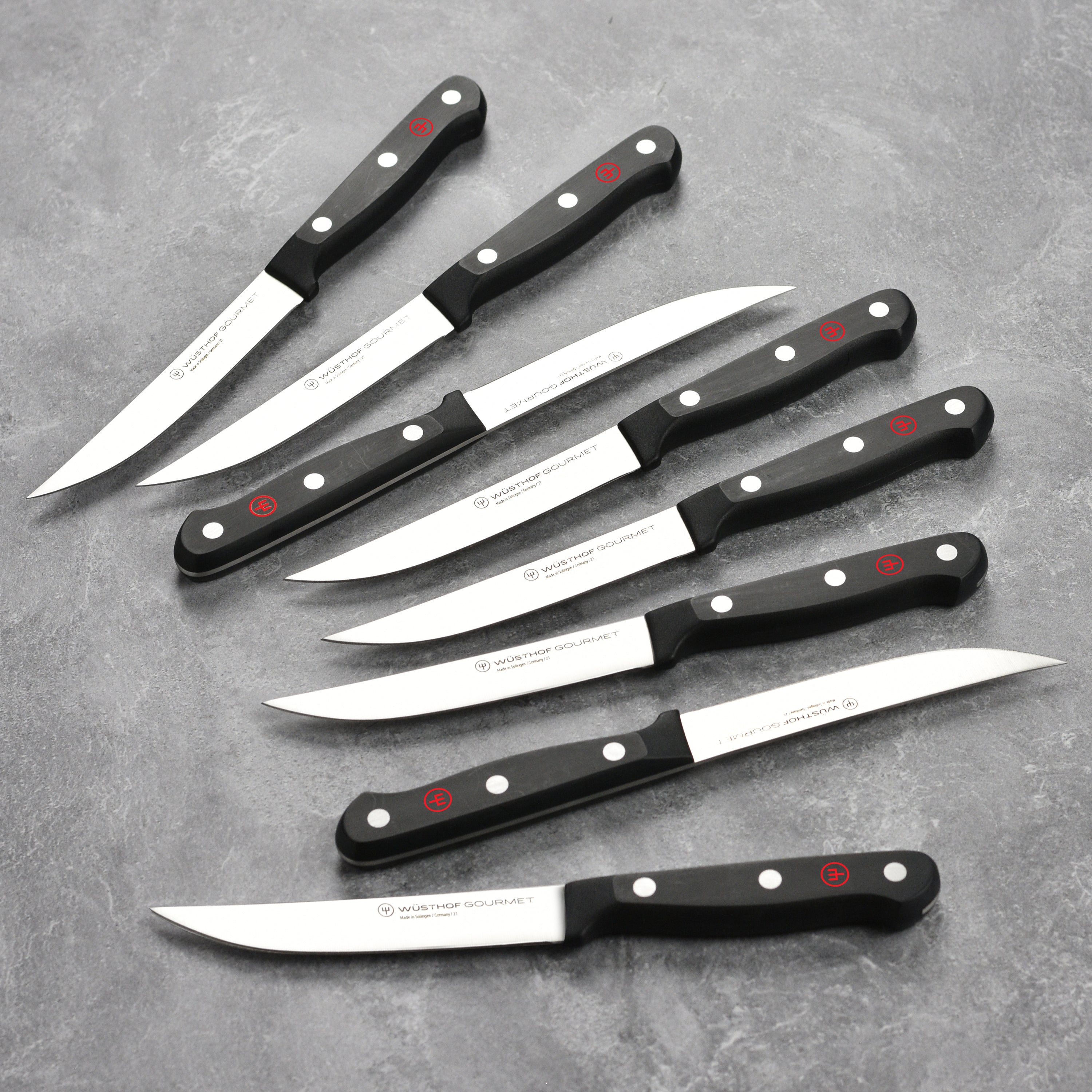 High-carbon stainless steel steak knives with polished blades and ergonomic handles