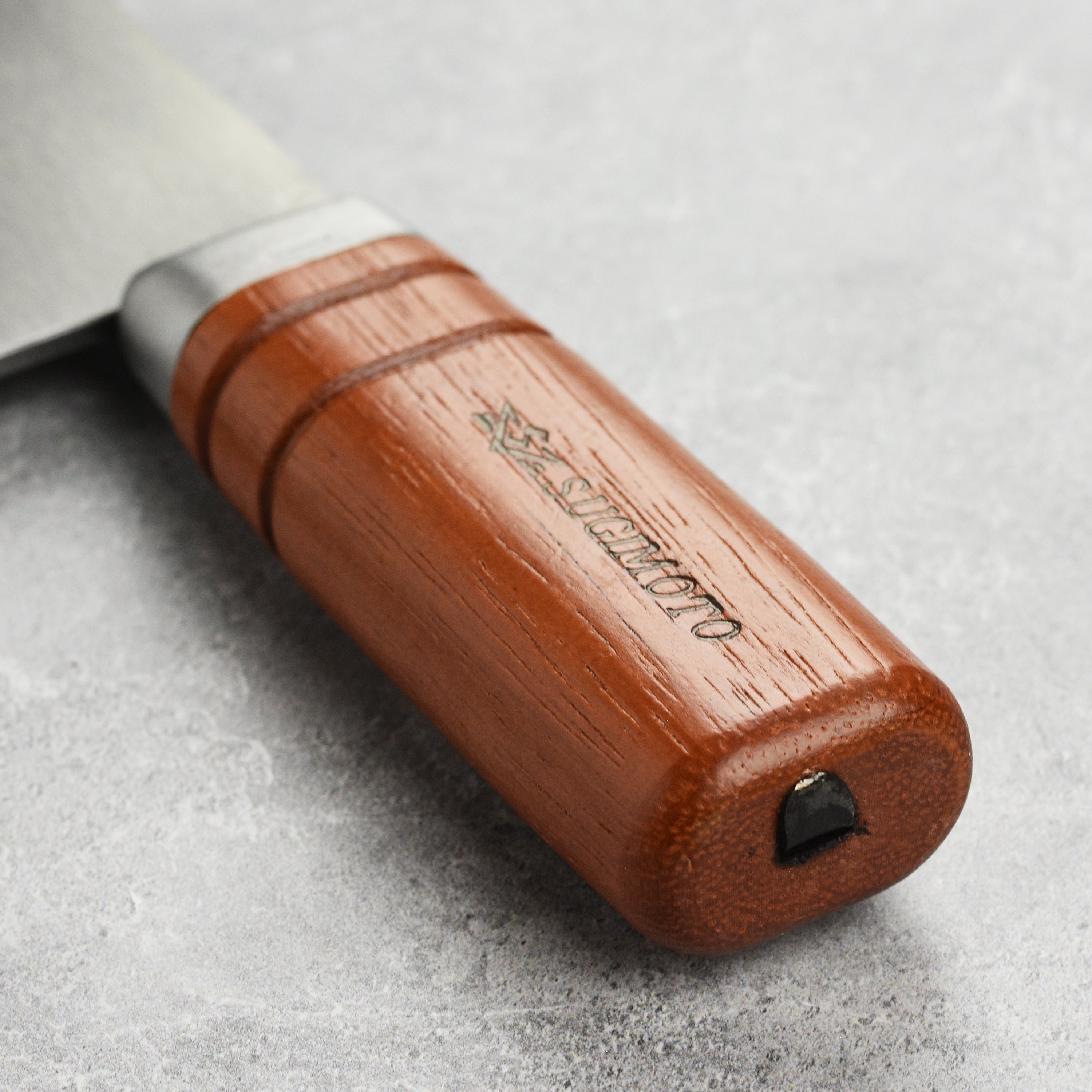 Close-up of the sharp blade of the Sugimoto Chinese cleaver, showcasing its precision.