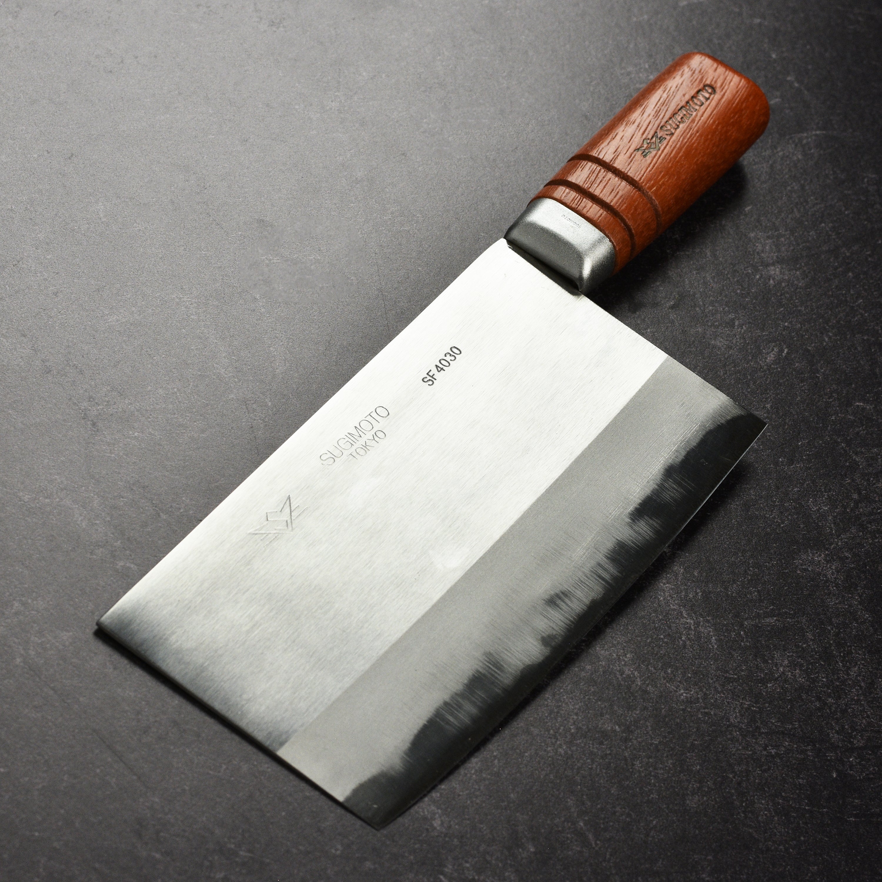 Close-up of the Sugimoto Professional Grade Chinese cleaver showing the carbon steel blade.
