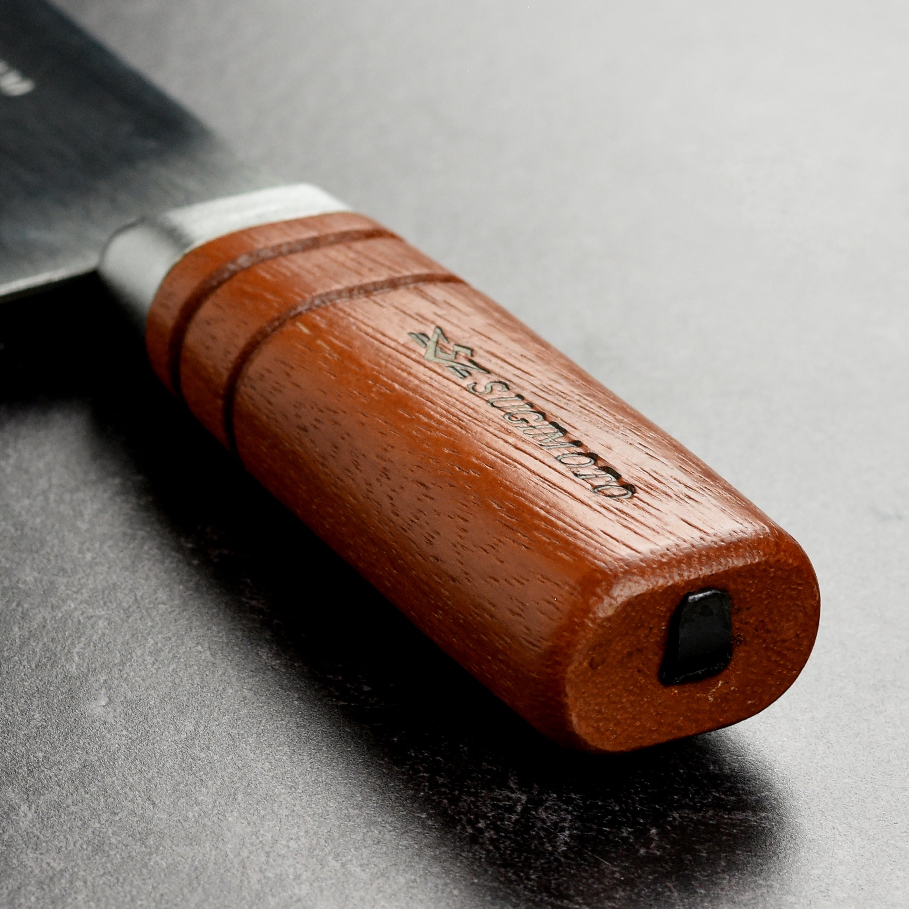 Close-up of the Sugimoto Professional Grade Chinese cleaver showing the carbon steel blade.