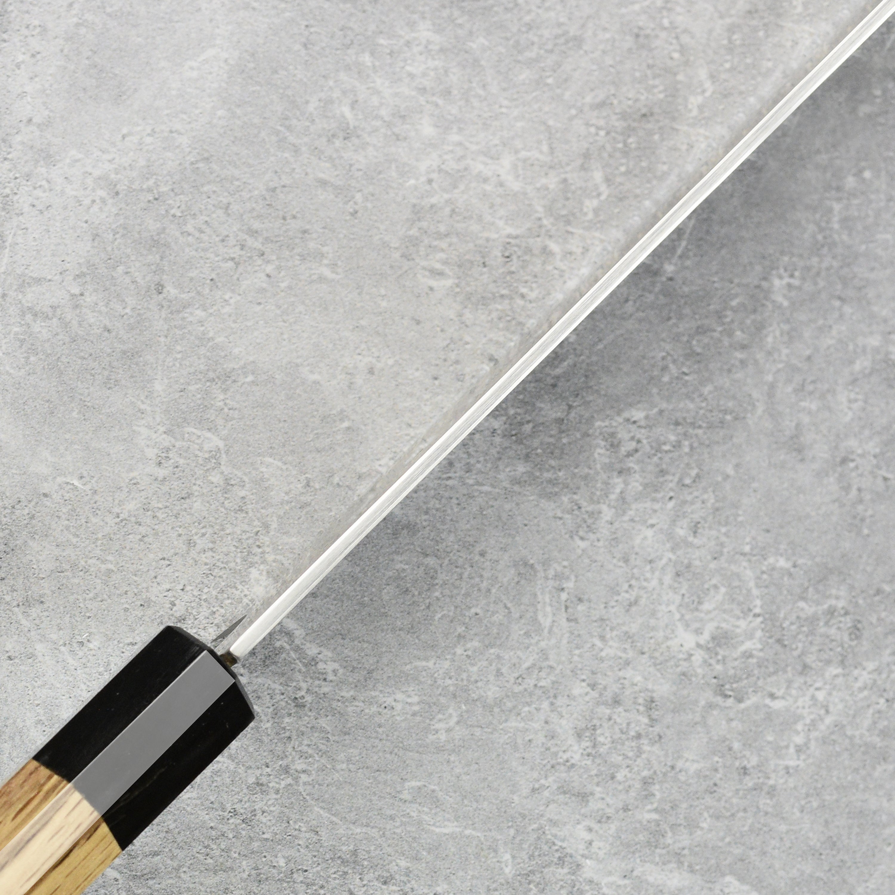 Sukenari ZDP189 being used to slice vegetables, demonstrating its precision and balance.