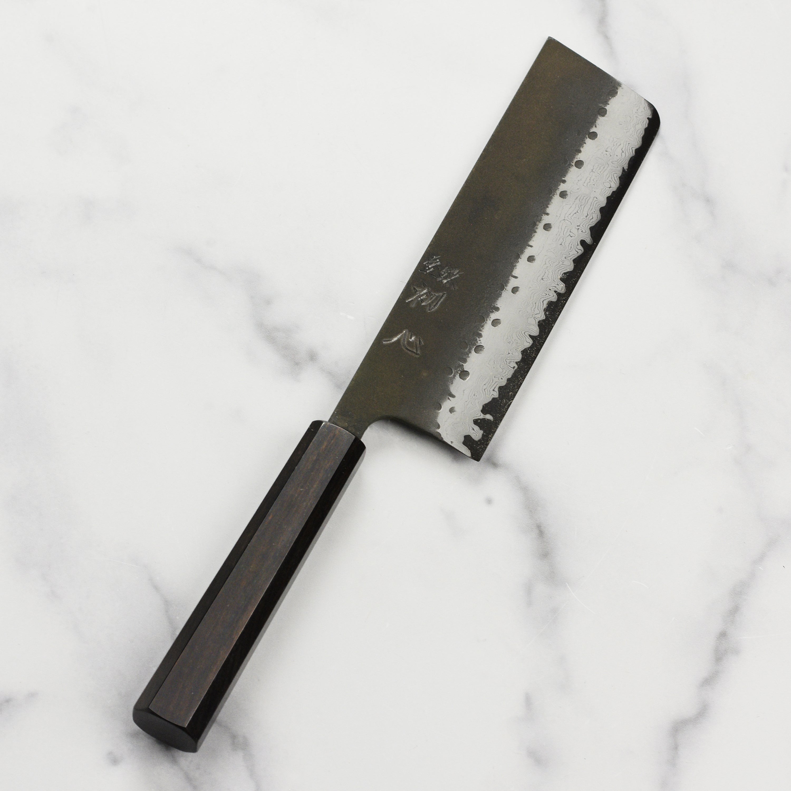 Ergonomic handle of the nakiri knife for comfortable grip