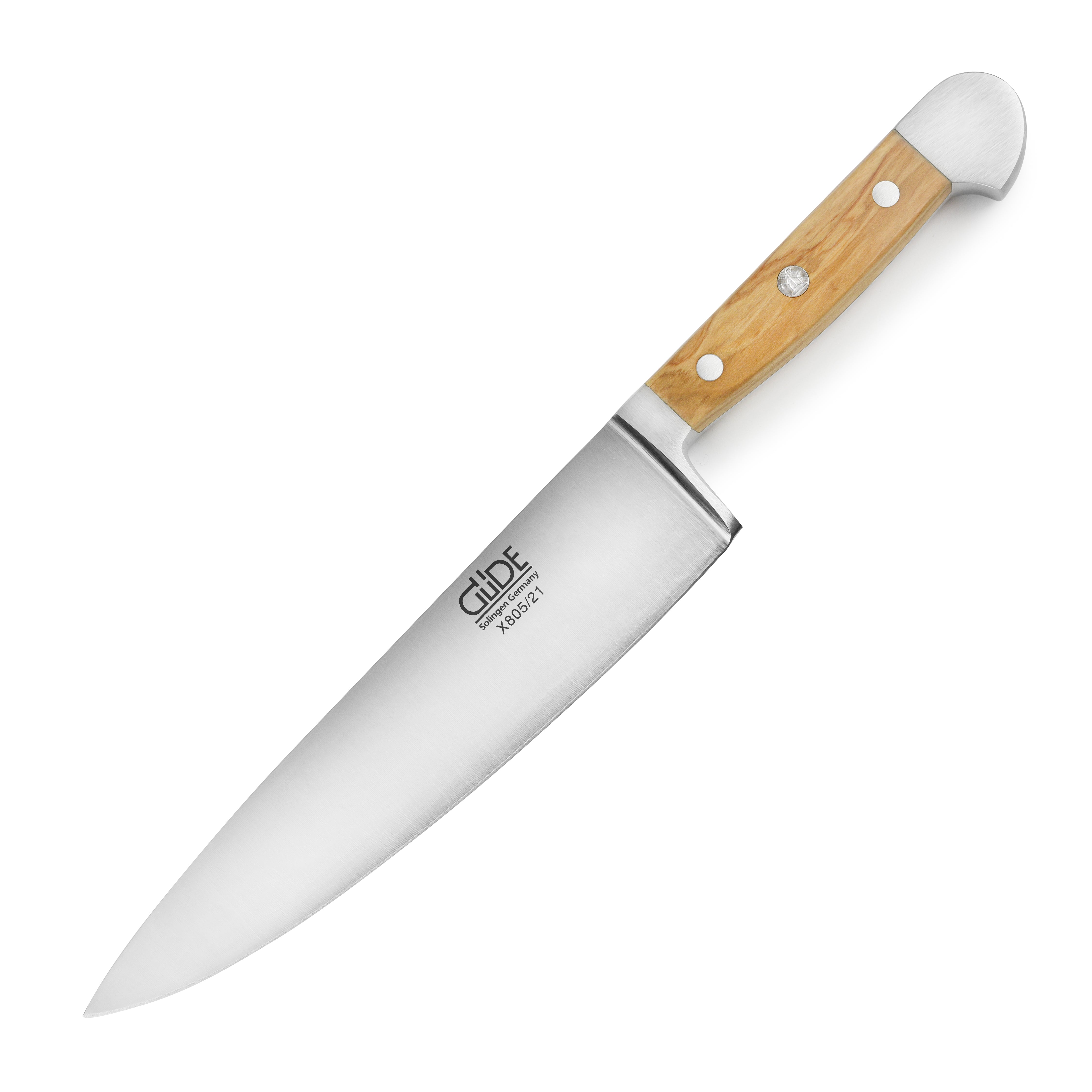 Gude Alpha Olive Chefs Knife displayed on a wooden cutting board, highlighting its ergonomic olive wood handle.