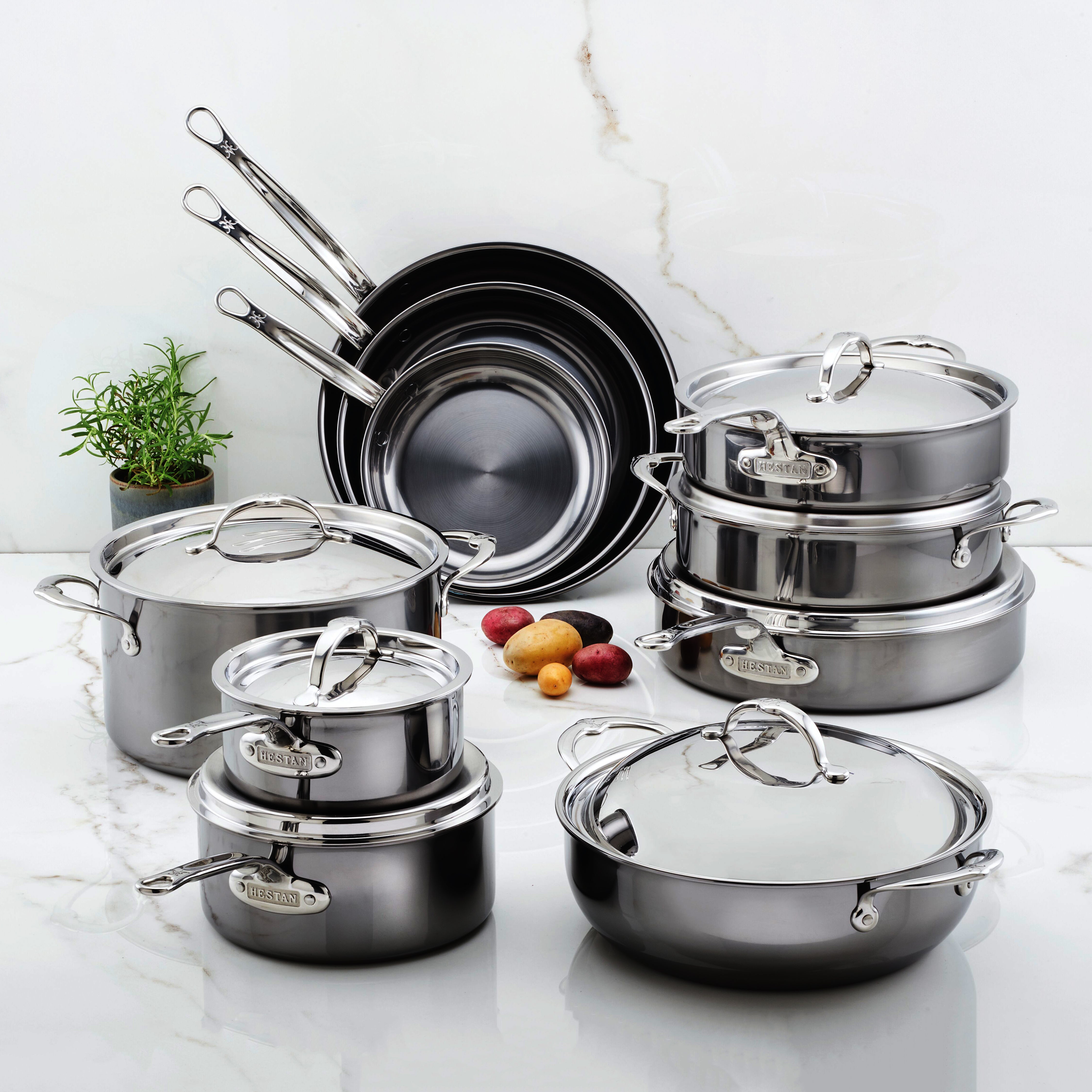 Hestan NanoBond 17 piece titanium stainless steel cookware set on stovetop showing sleek design