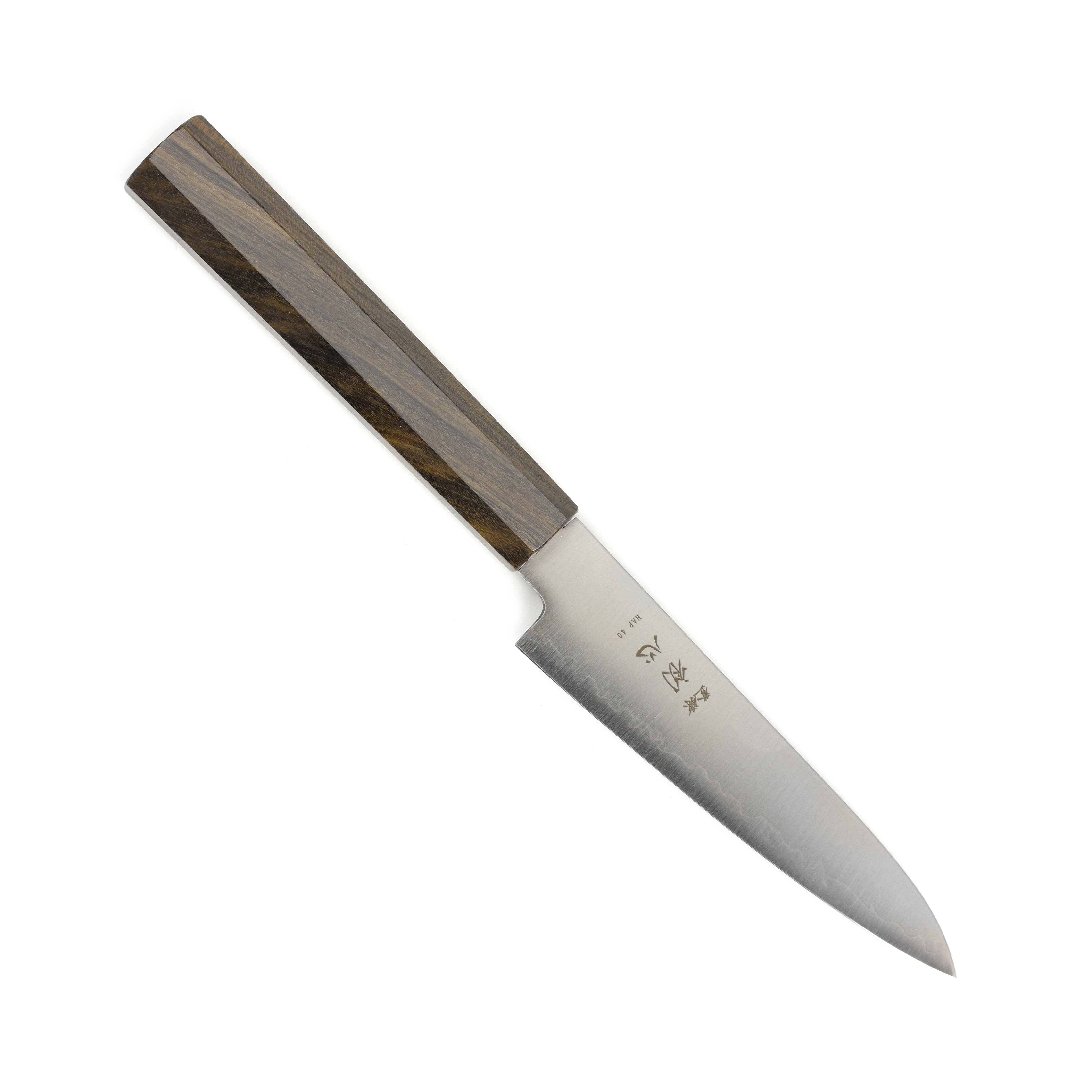 Hatsukokoro Hayabusa HAP40 4.7" Precision Petty Knife displayed on a wooden cutting board, highlighting its sharp blade and beautiful design.