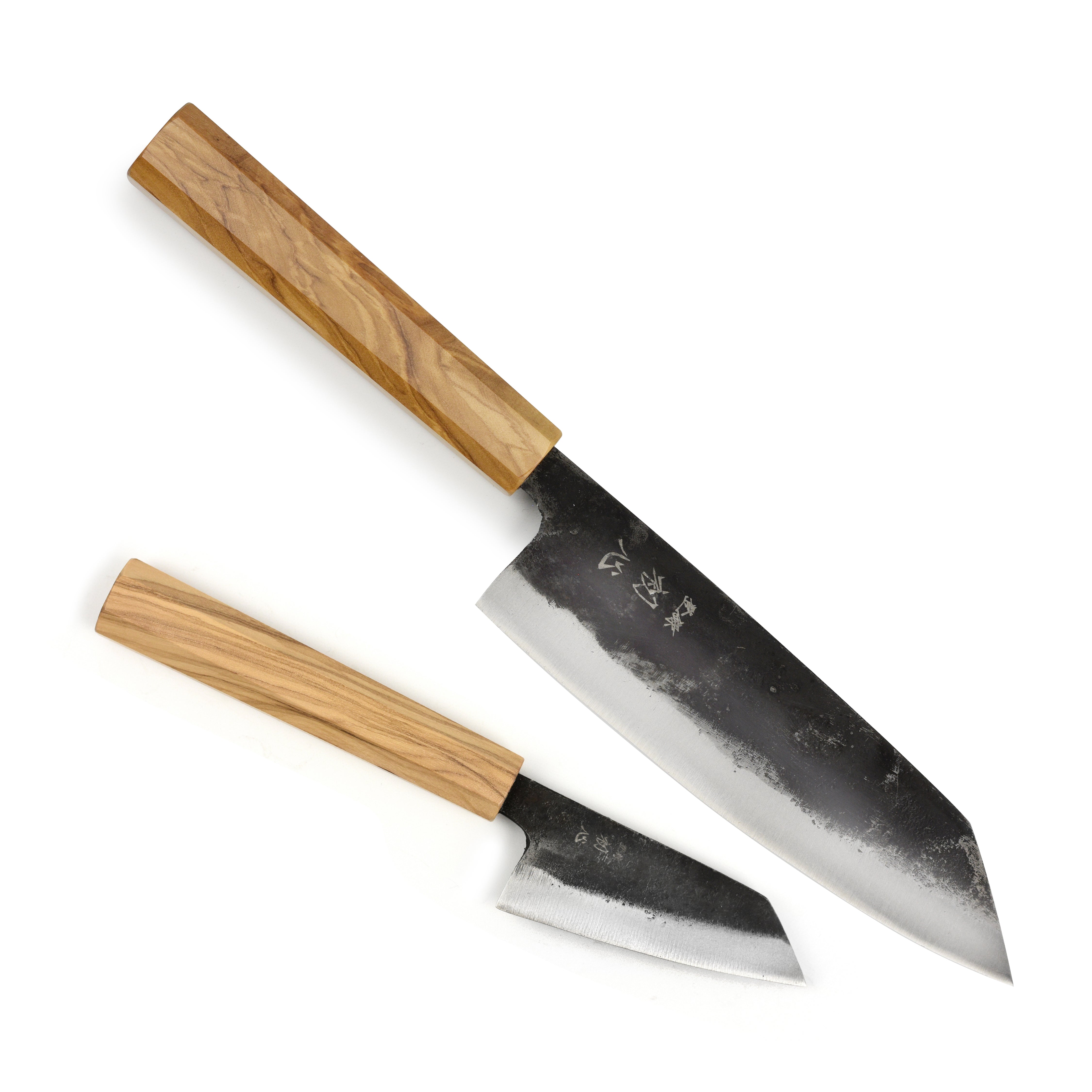 Hatsukokoro Aogami #2 Kurouchi Bunka Knife Set displayed on a wooden cutting board, showcasing its sleek design and high carbon steel blade.