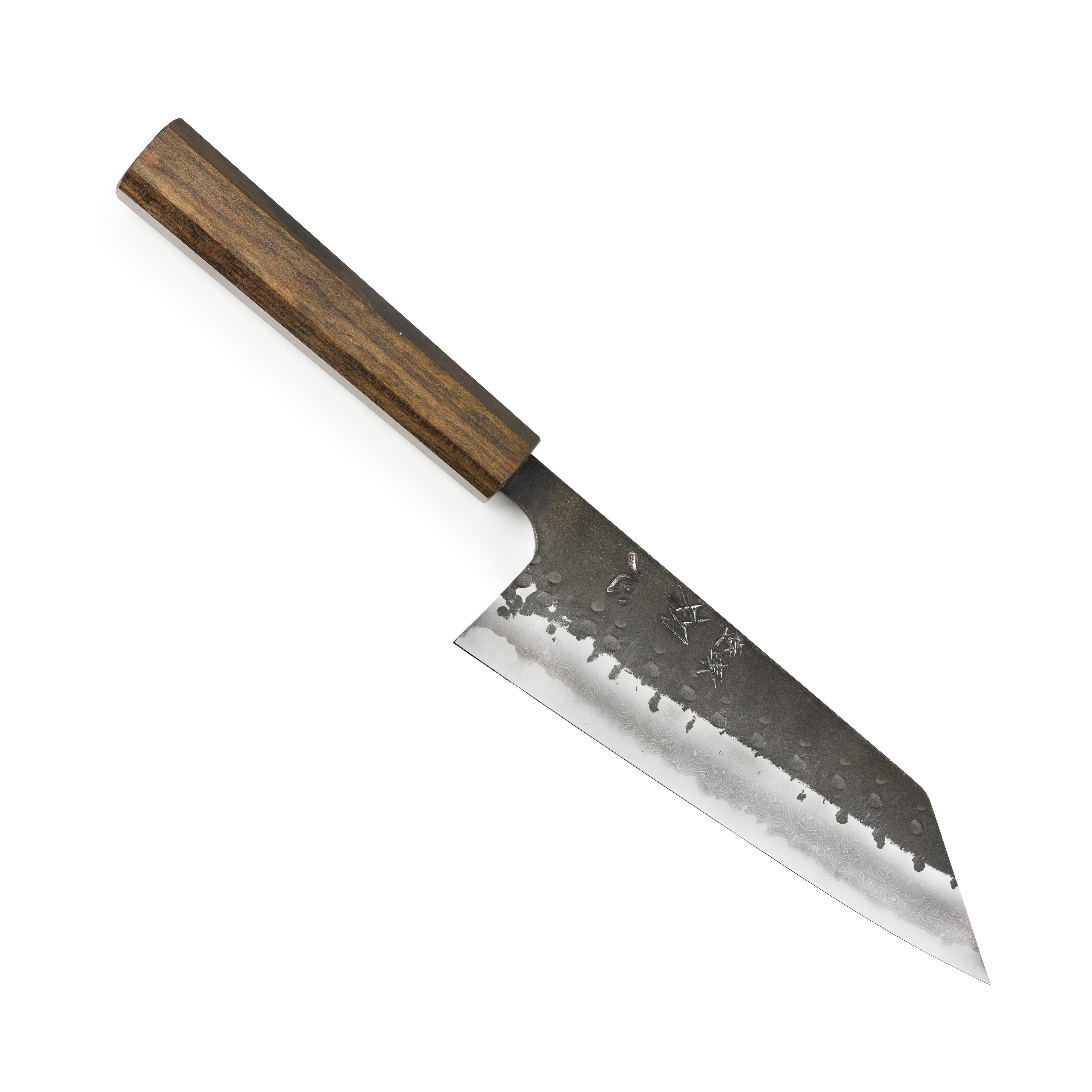 Detail shot of the high carbon steel blade and bubinga handle of the Japanese kitchen knife