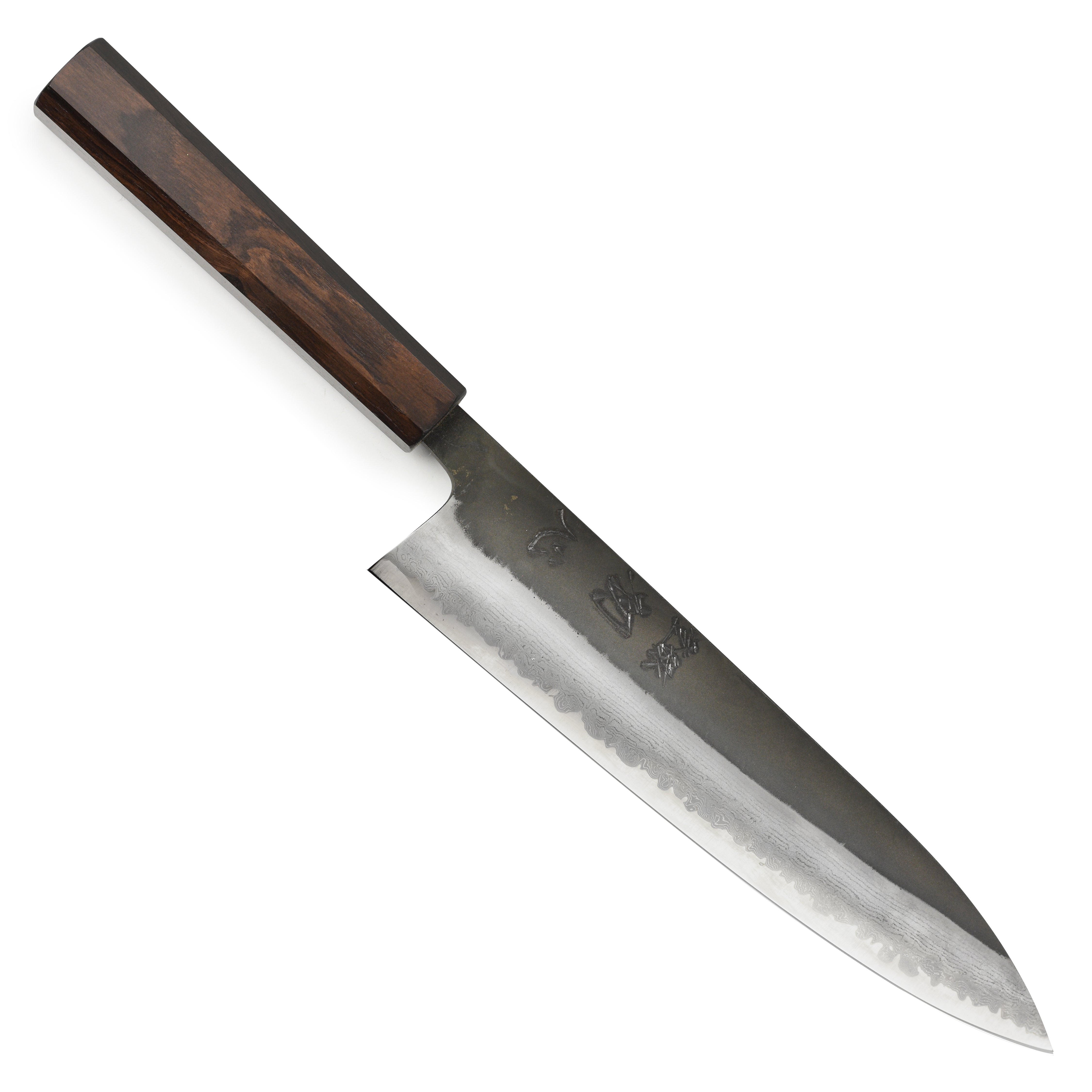Japanese chef knife in action slicing vegetables on a cutting board