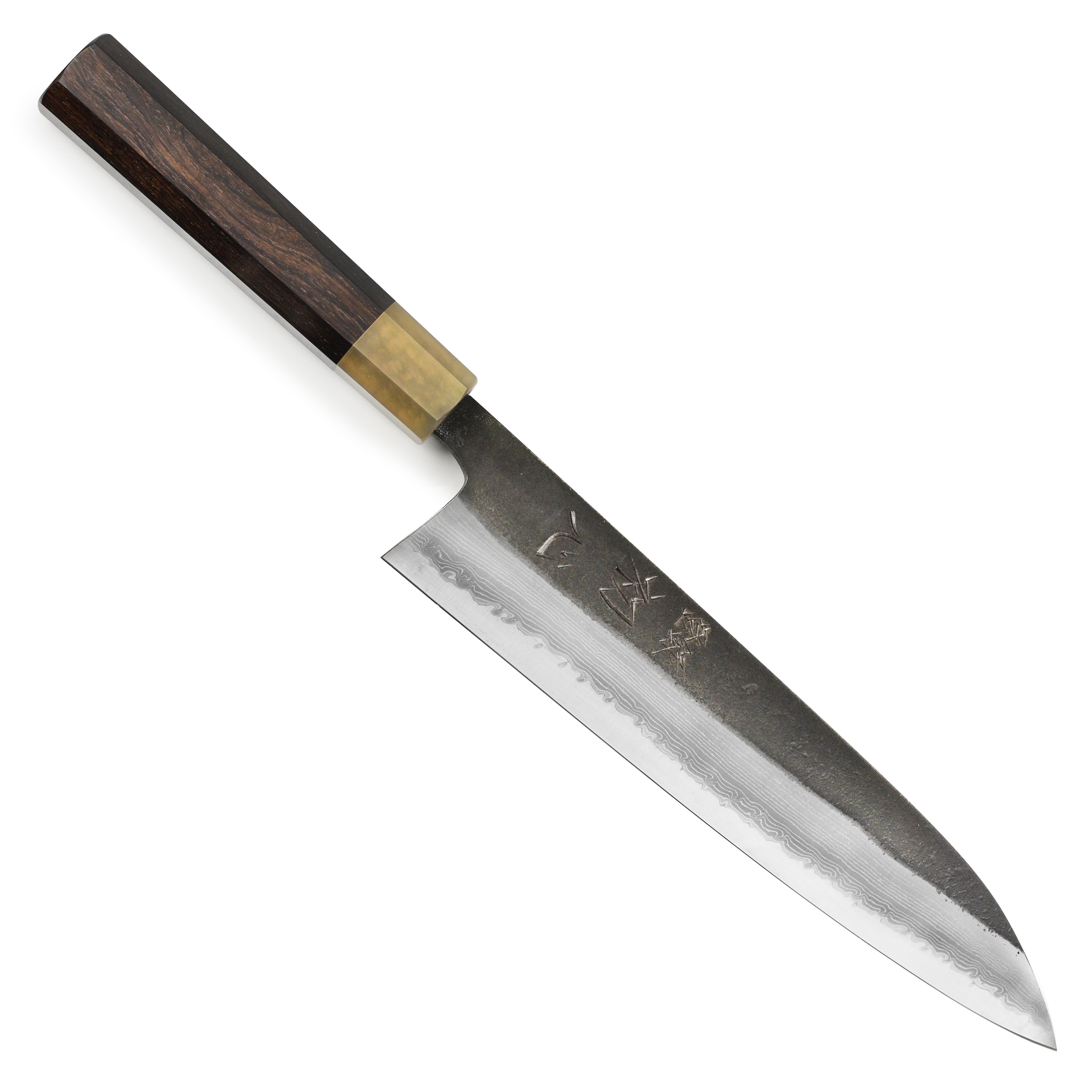 Hatsukokoro Gyuto Knife in use, expertly cutting fresh vegetables on a wooden board.