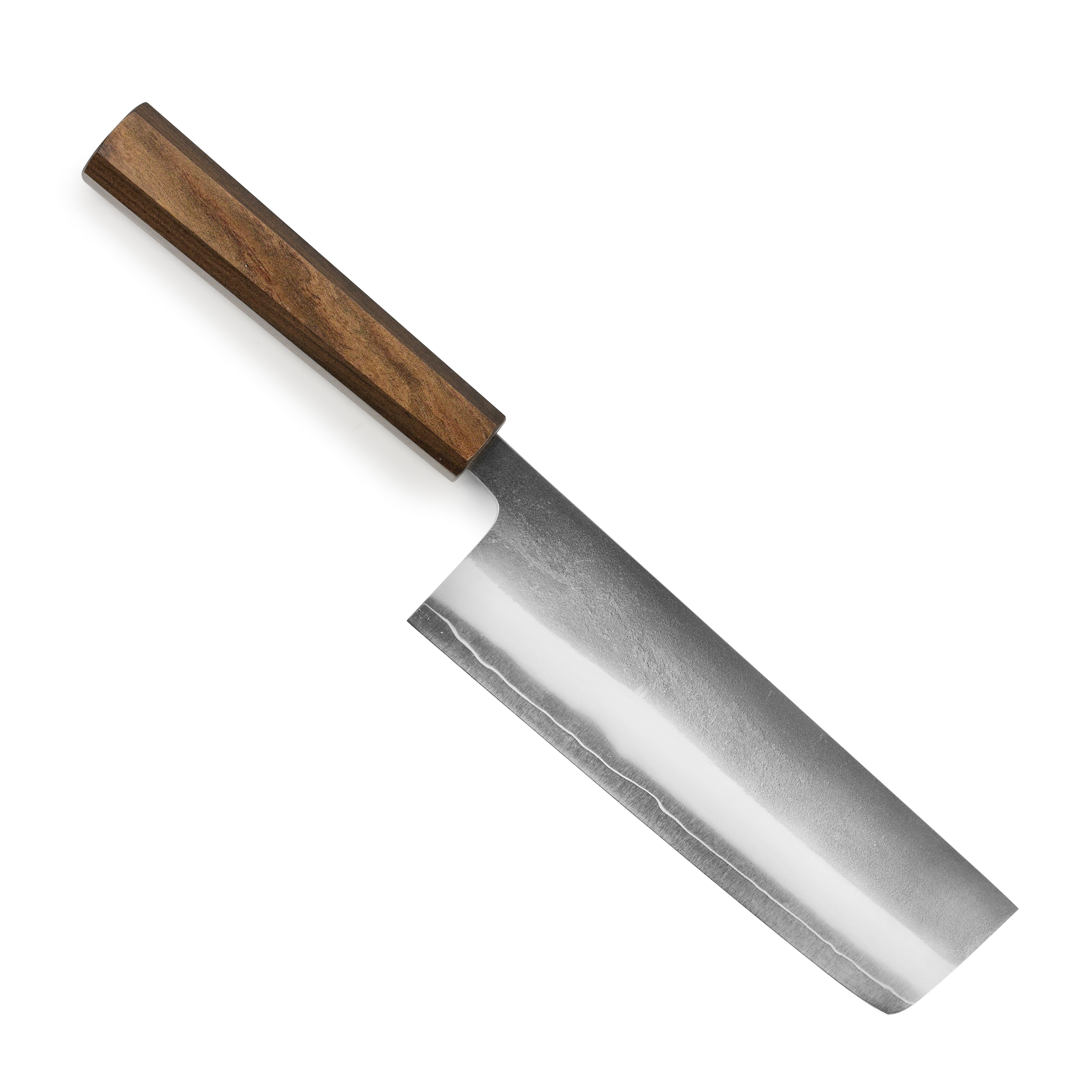Yoshikane SKD Nashiji Nakiri knife from the side, highlighting its sharp edge and stainless steel finish.