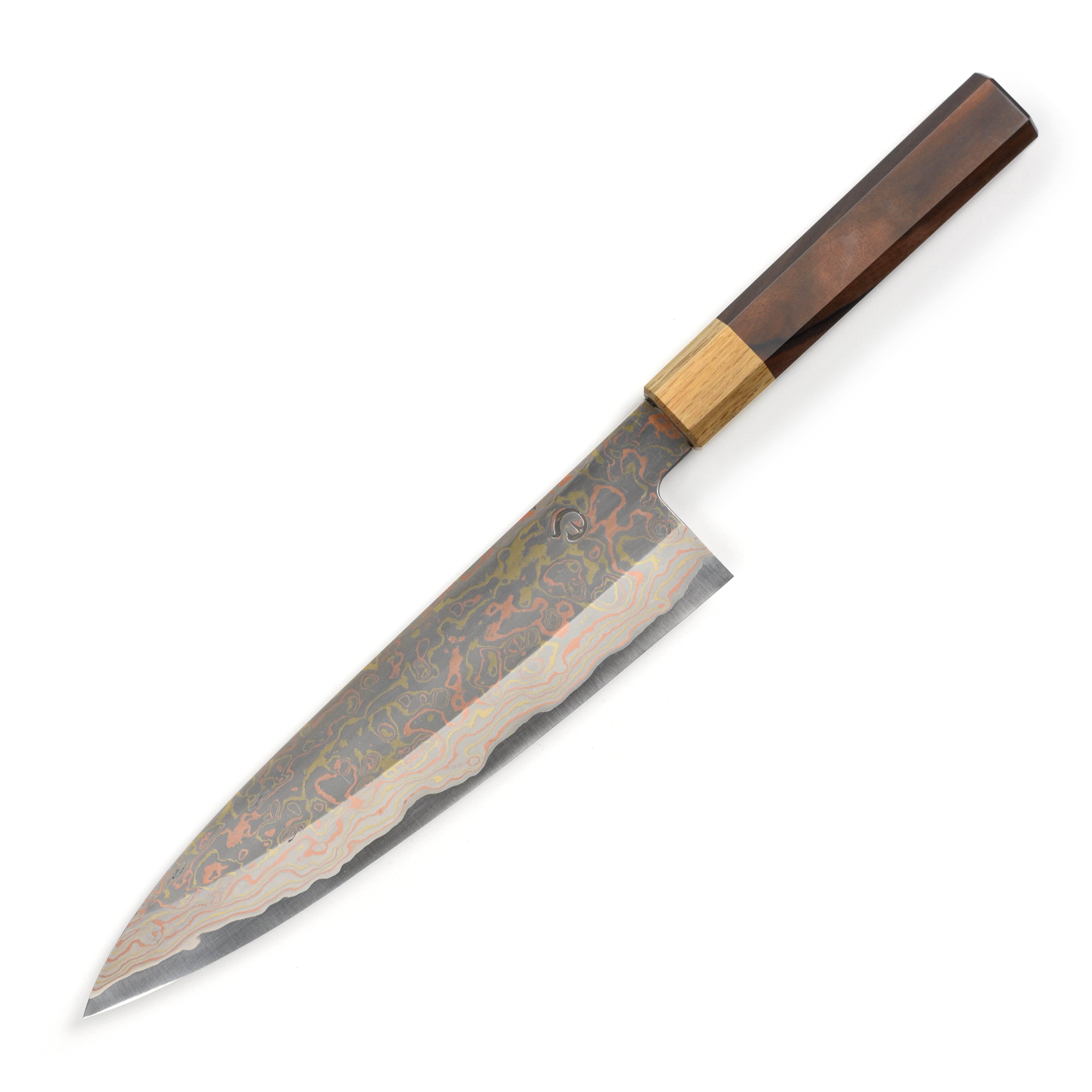 Hinoura Aogami #2 Gyuto knife in action, slicing vegetables with precision.