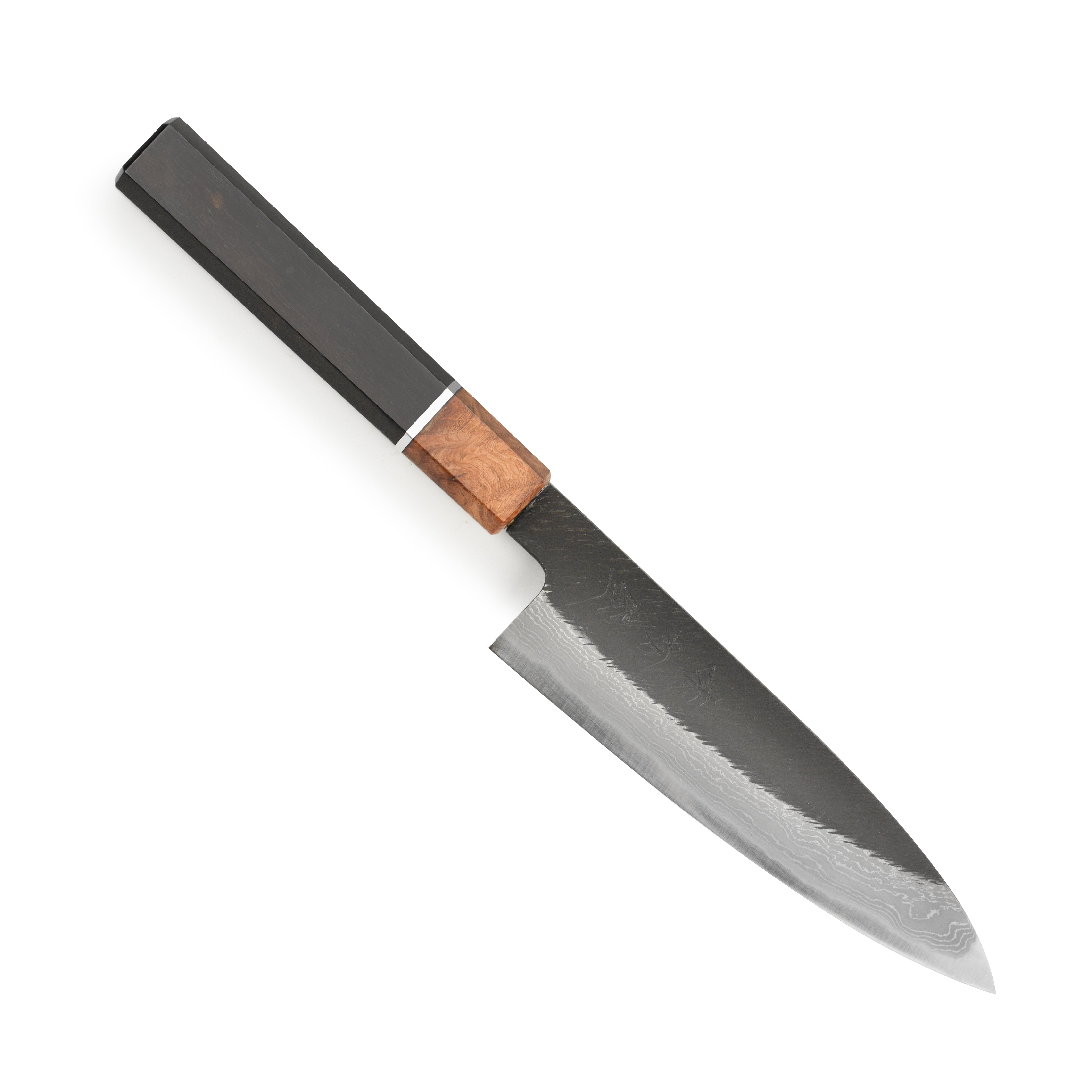 Hinoura Damascus knife highlighting its blade design and craftsmanship
