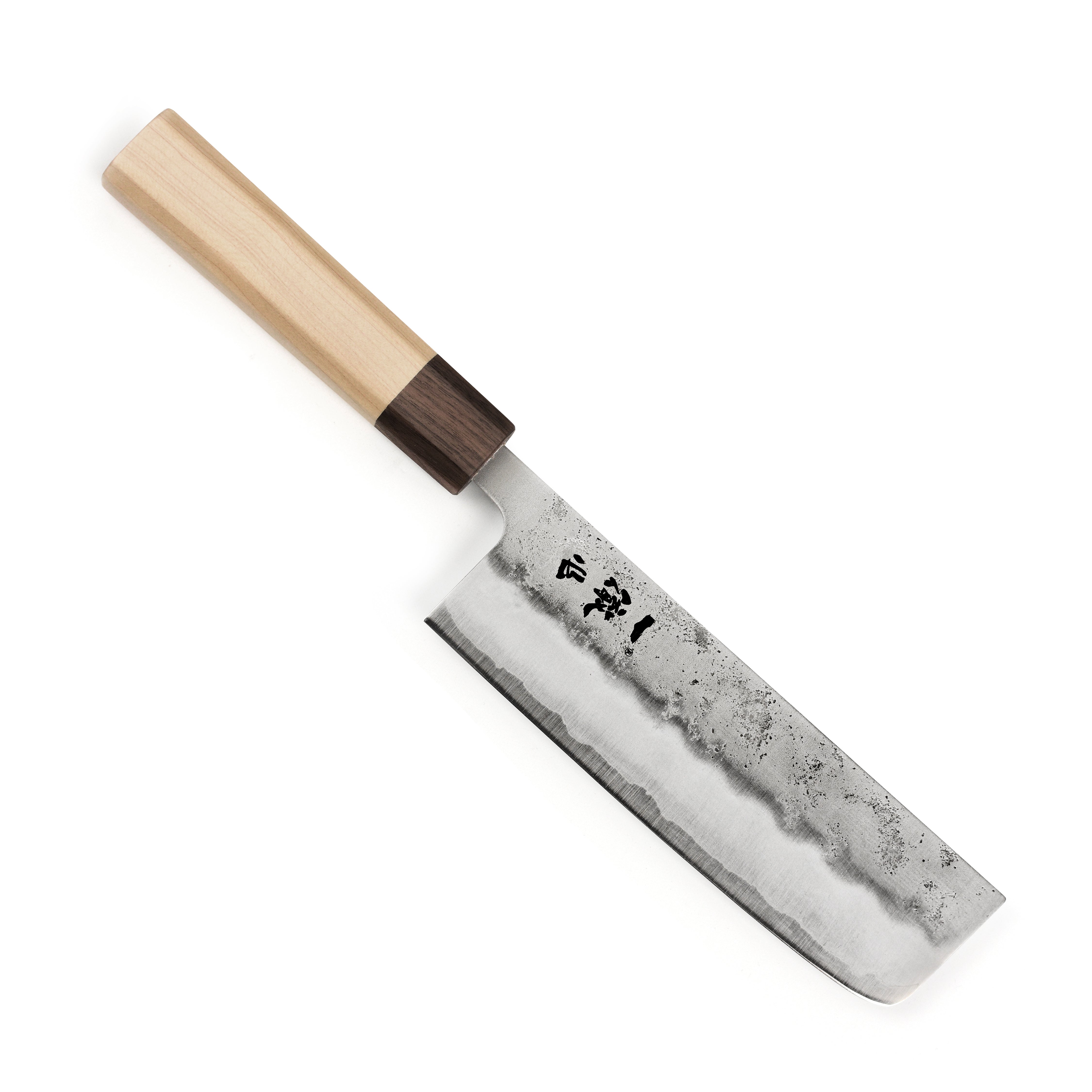 Using the Japanese kitchen knife for slicing vegetables in a modern kitchen