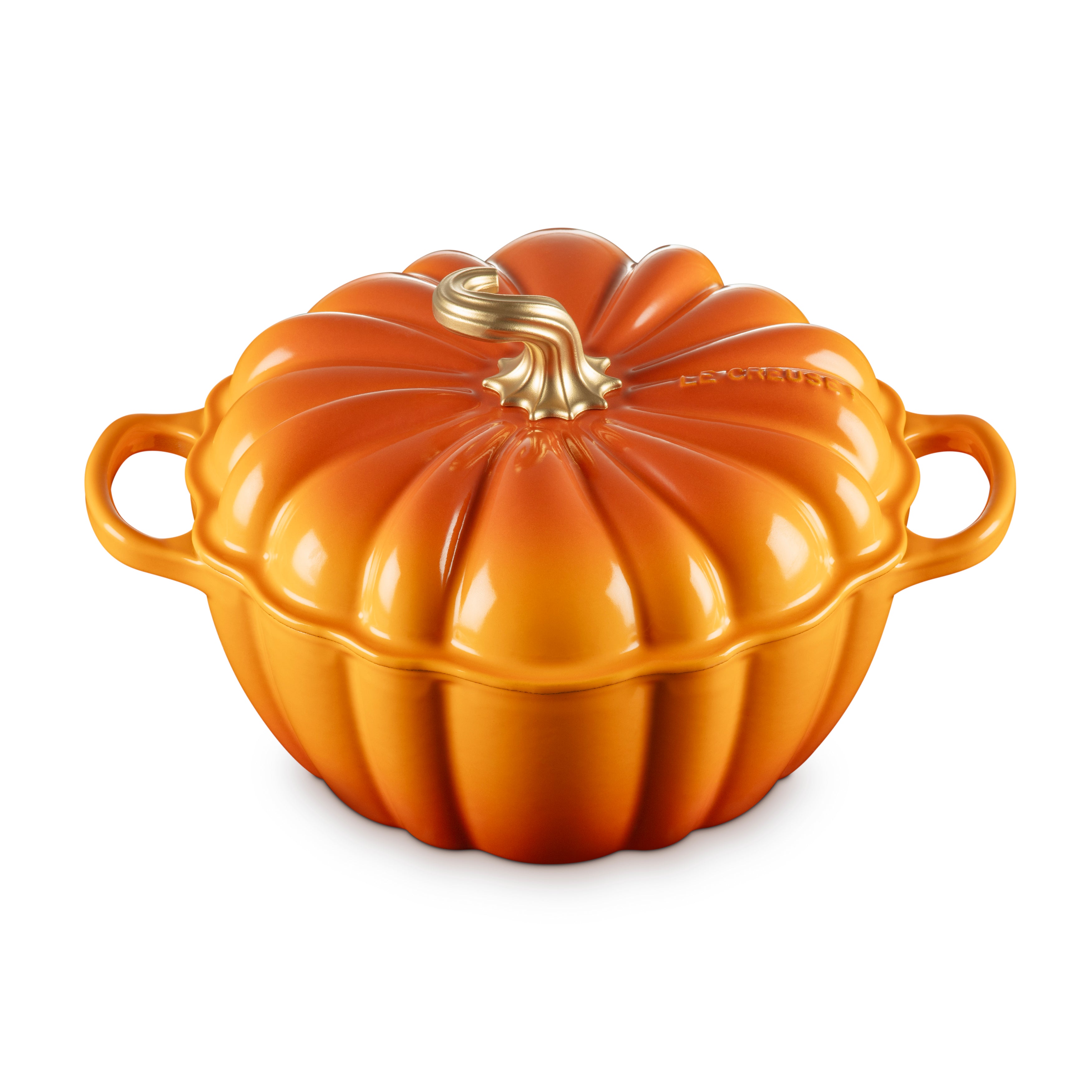 Le Creuset pumpkin cocotte angled view with lid on, perfect for fall dishes.