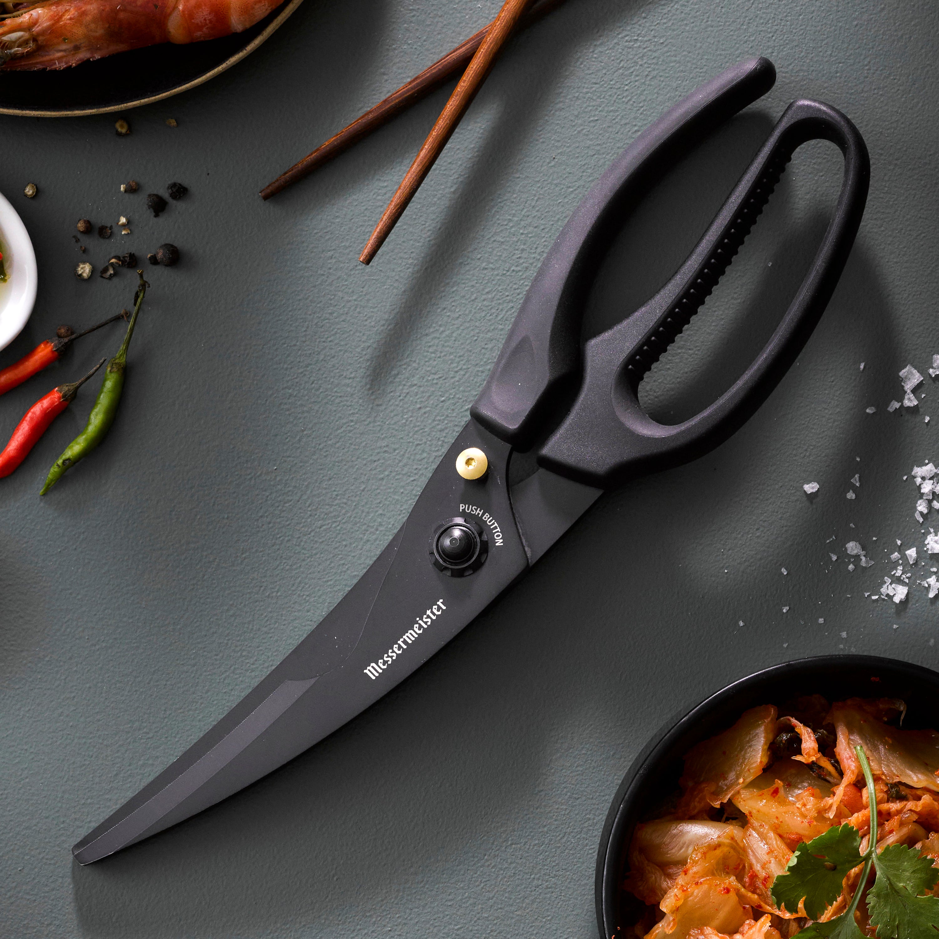 Titanium Pro Poultry Shears in action, cutting through poultry with precision.