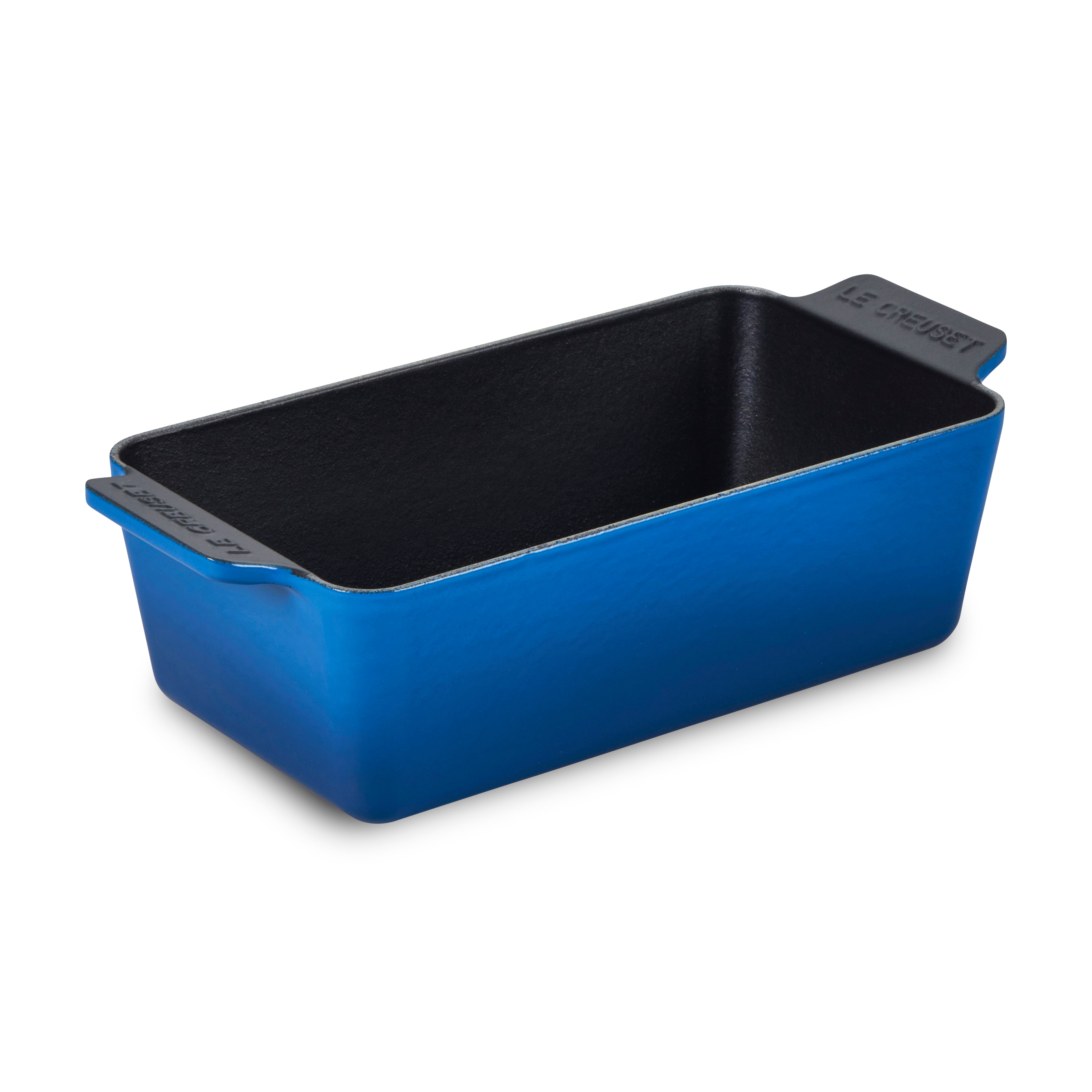Le Creuset Signature Cast Iron Loaf Pan on a baking countertop, showcasing its durable enamel finish