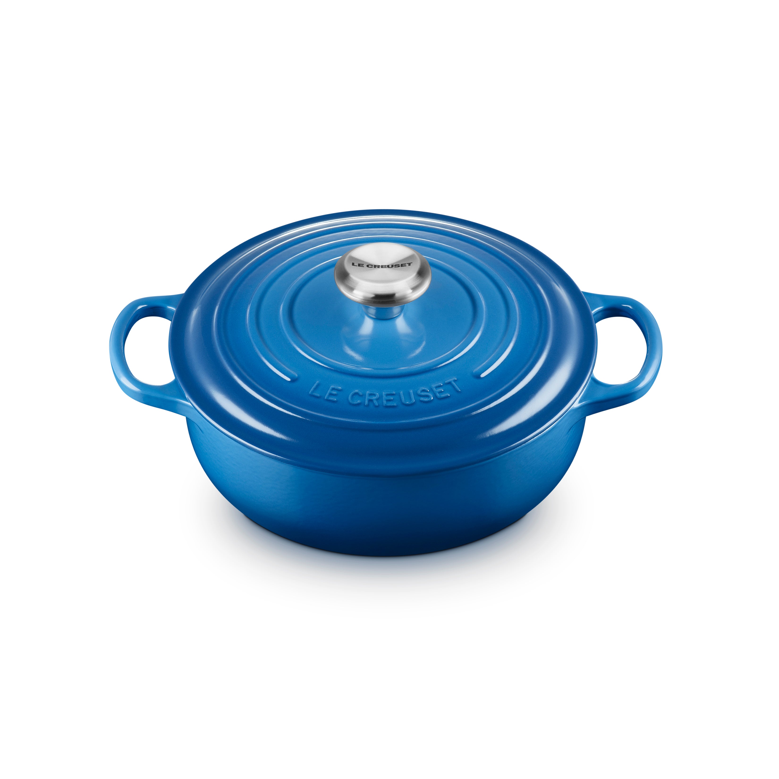 Le Creuset Marseille 3.5-quart enameled cast iron Dutch oven on stovetop, showcasing its durable enamel and ergonomic handles