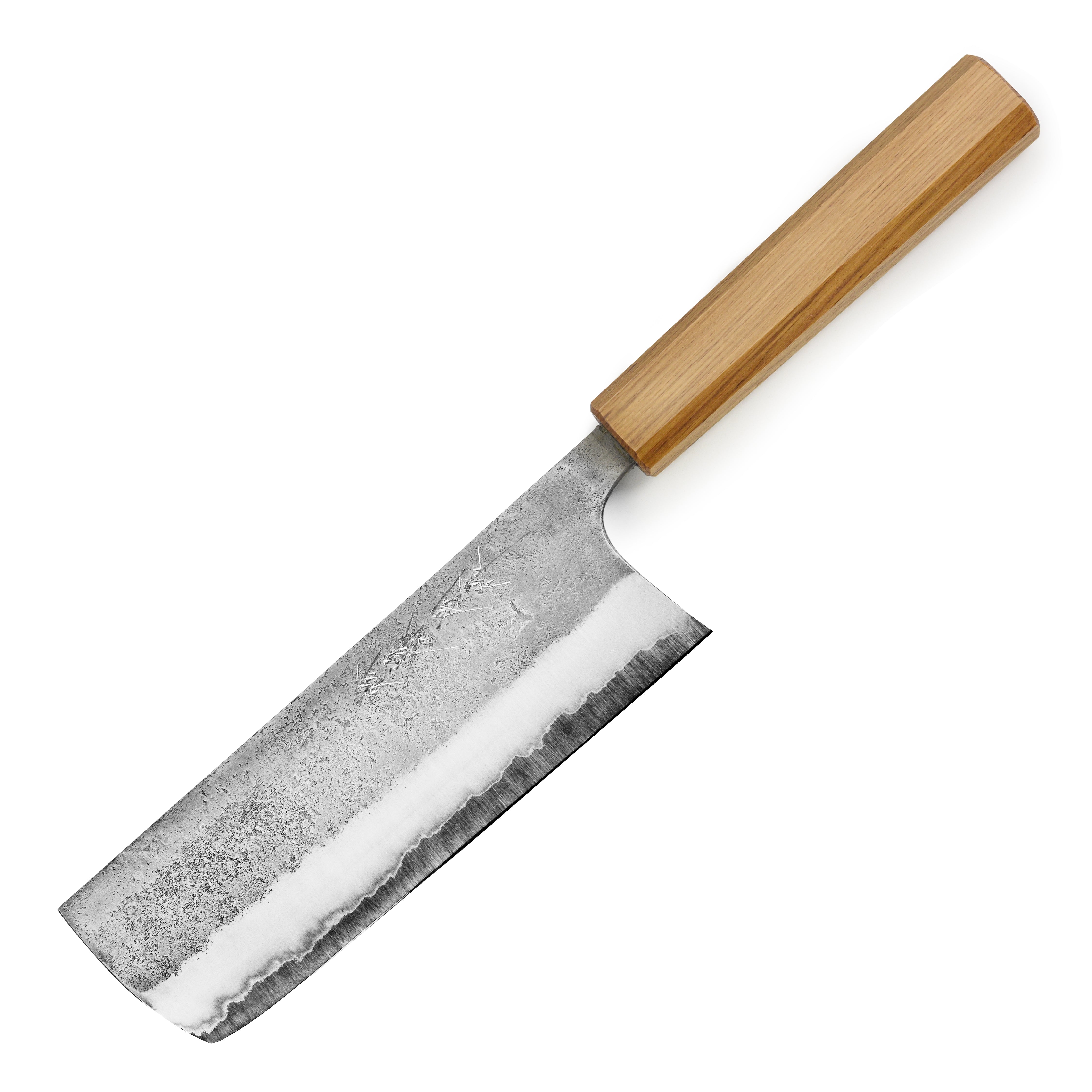 Chef slicing vegetables with the high-quality Japanese kitchen knife in a professional kitchen