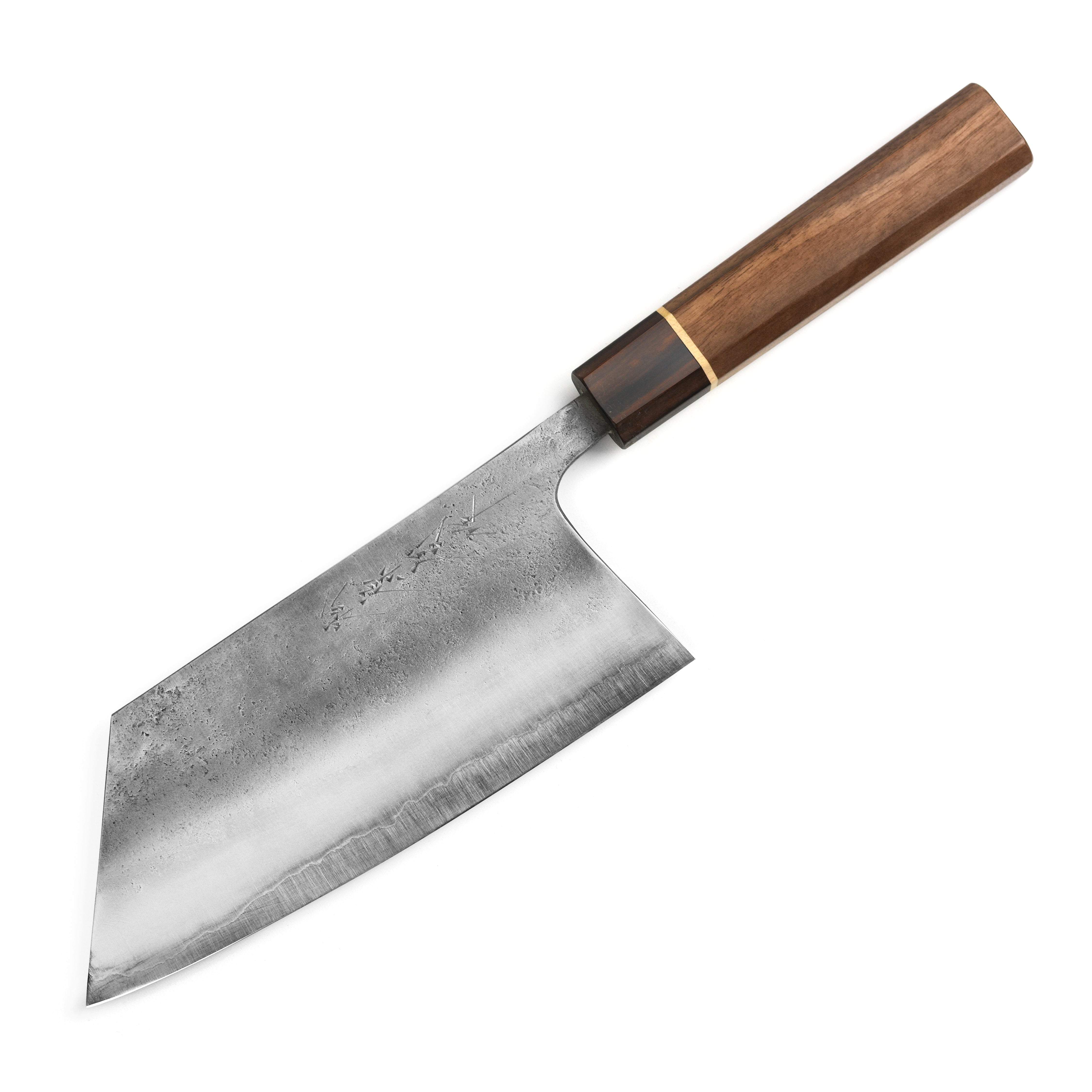 Matsubara Aogami kitchen cleaver in action, chopping fresh vegetables on a wooden cutting board.