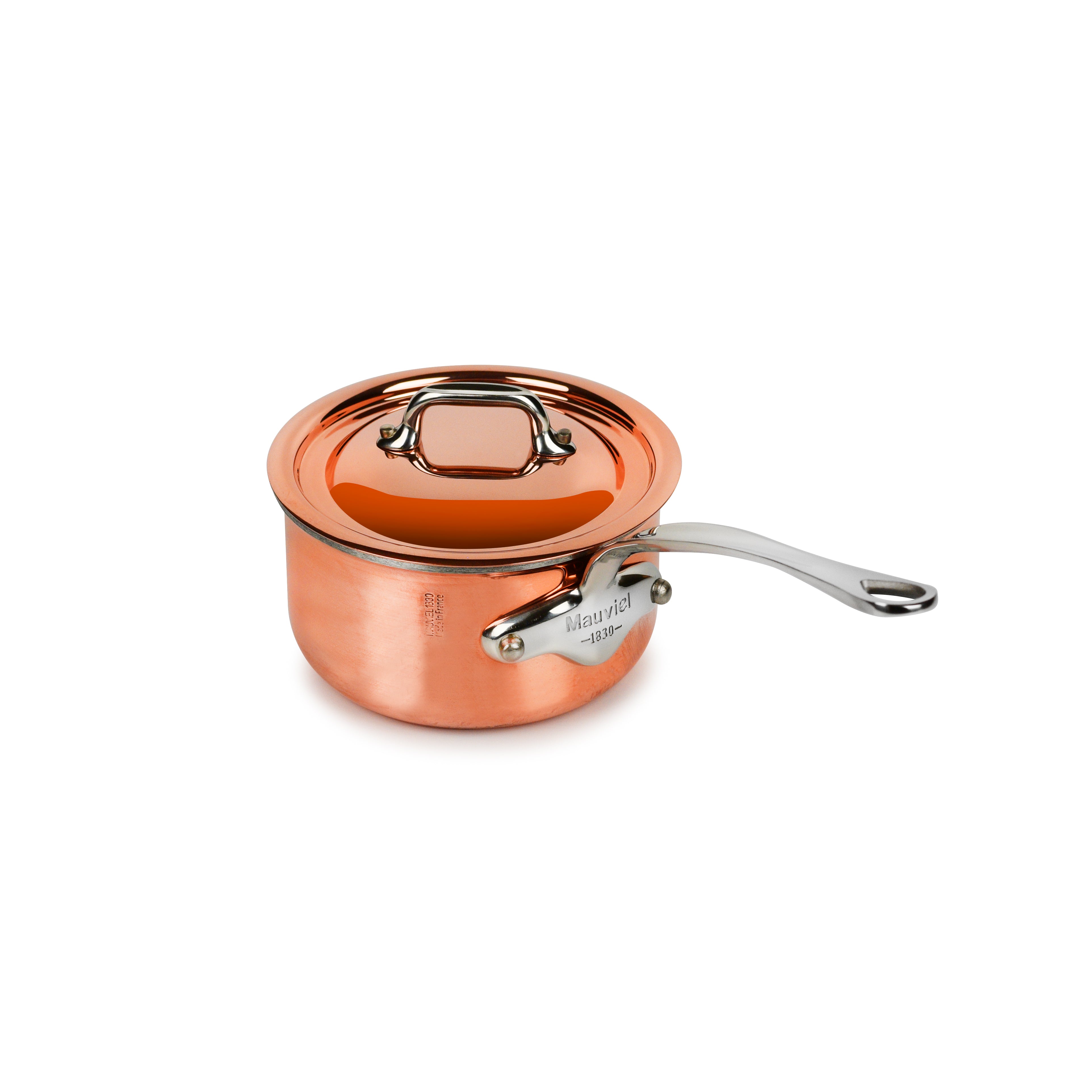 Close-up of the Mauviel copper saucepan showing its polished exterior and sturdy handles