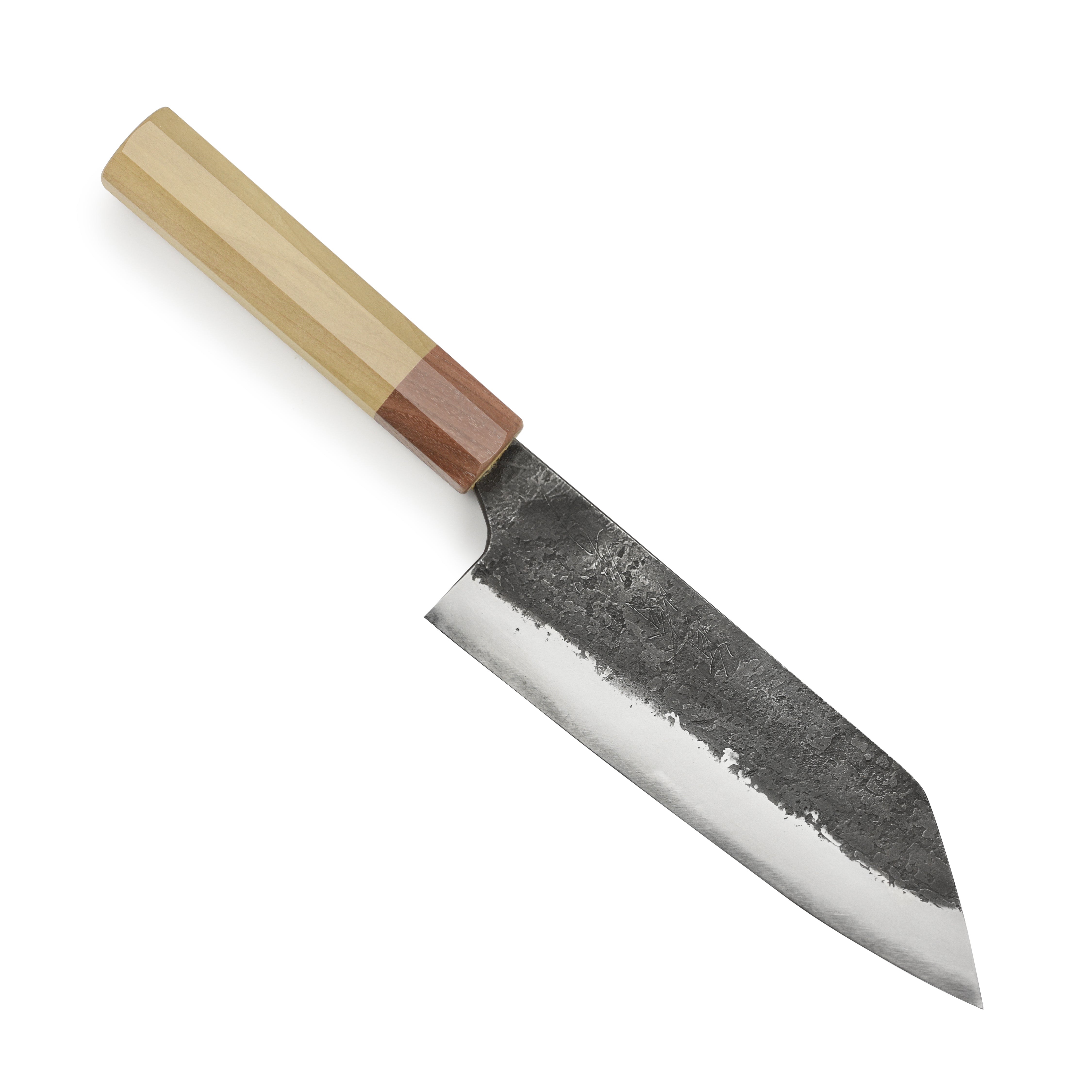 Mazaki Shirogami Santoku knife in action, expertly slicing through a piece of fish, demonstrating its versatility.