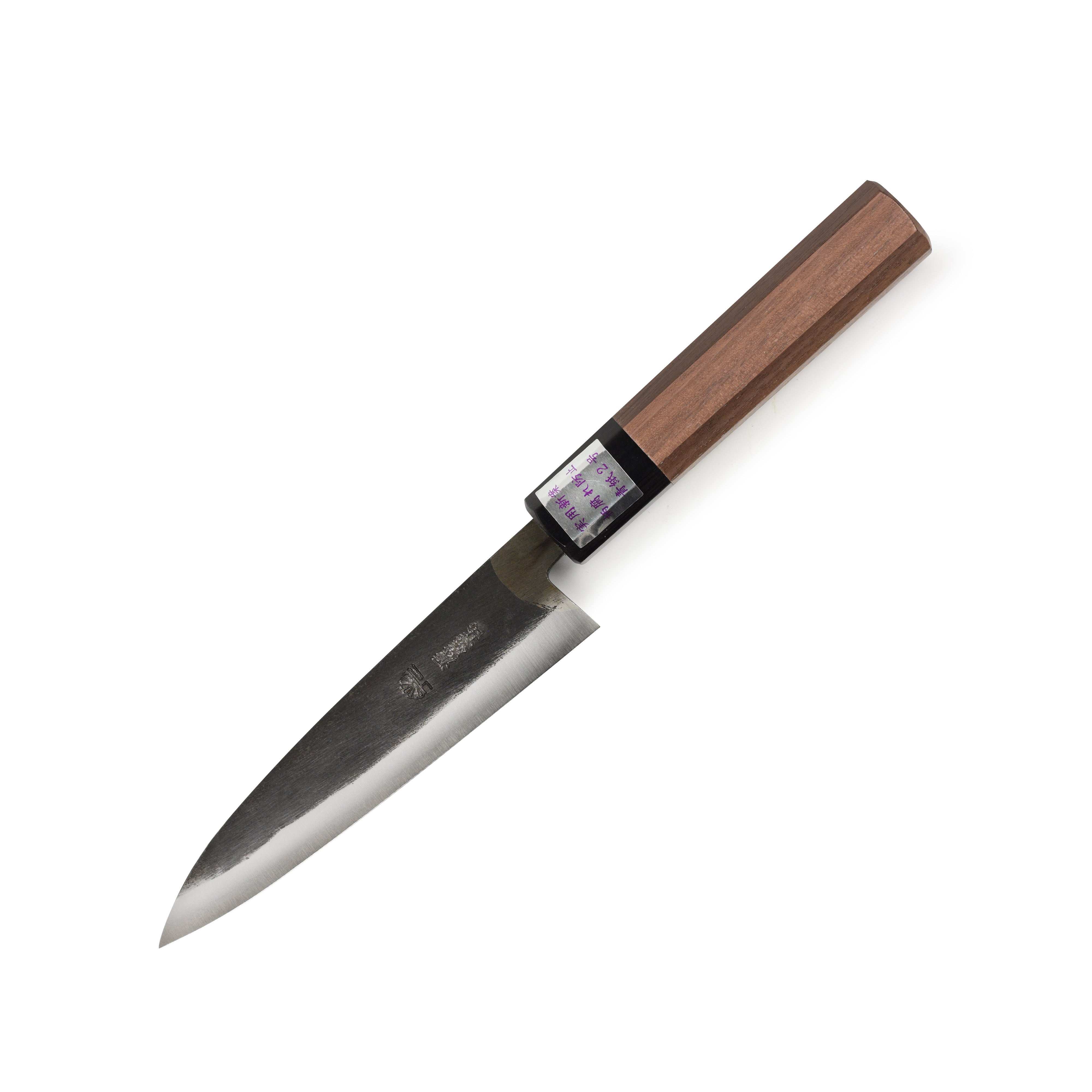 Close-up view of the Moritaka 5" Aogami #2 petty knife highlighting the hand-forged blade and walnut handle.