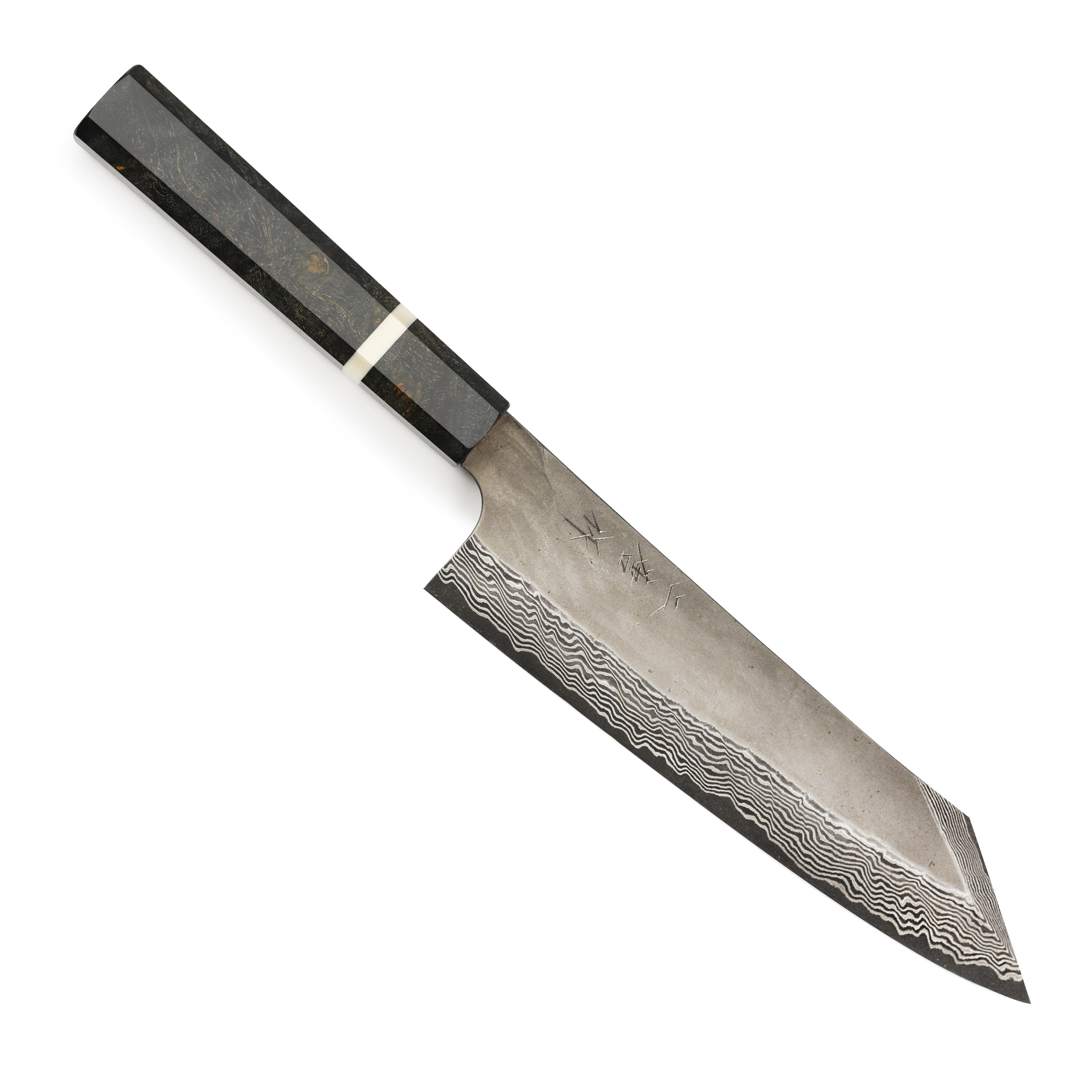 Chef slicing vegetables with a Nigara Ginsan damascus kitchen knife in a professional kitchen setting