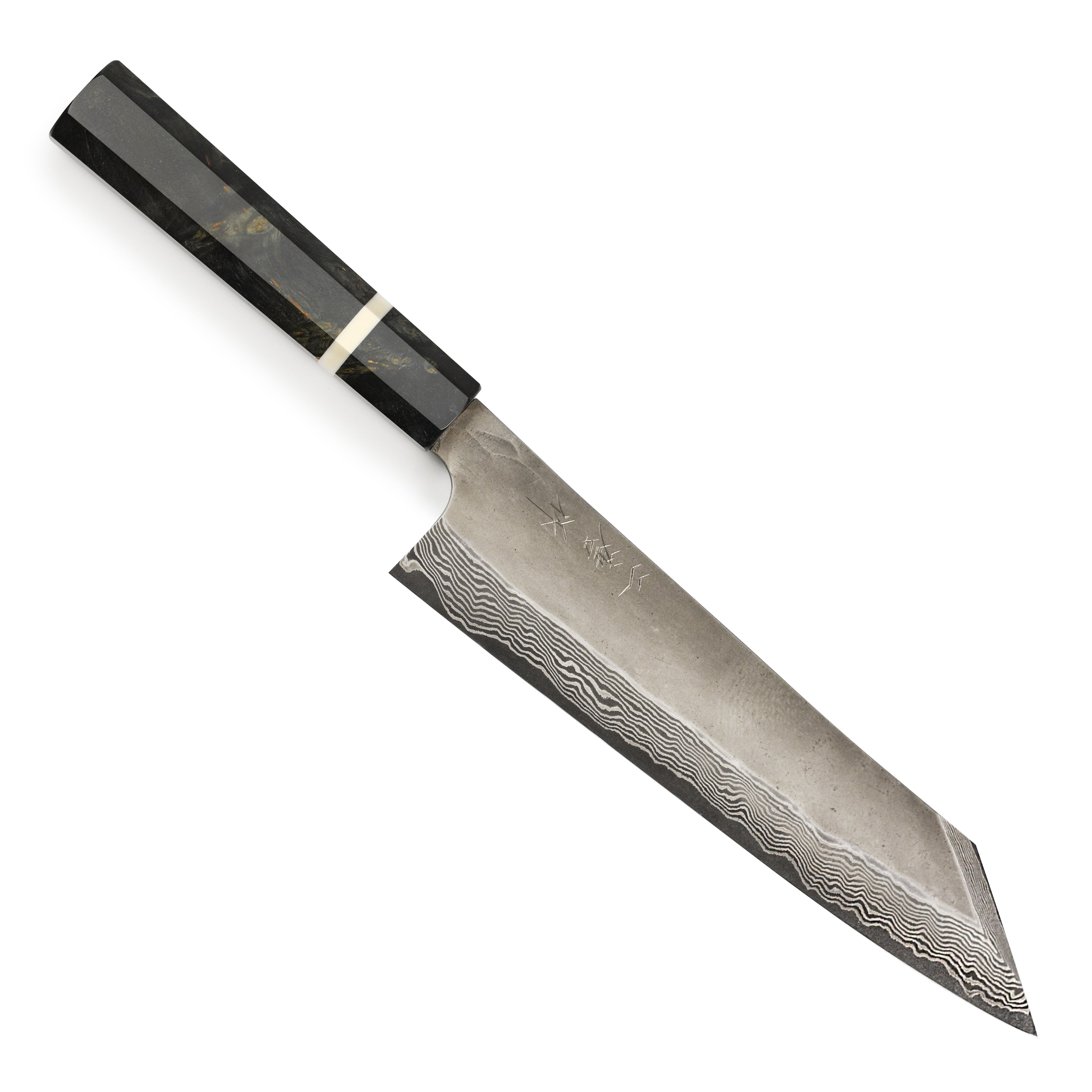 A chef using the 9.4-inch Damascus knife to slice vegetables with precision.