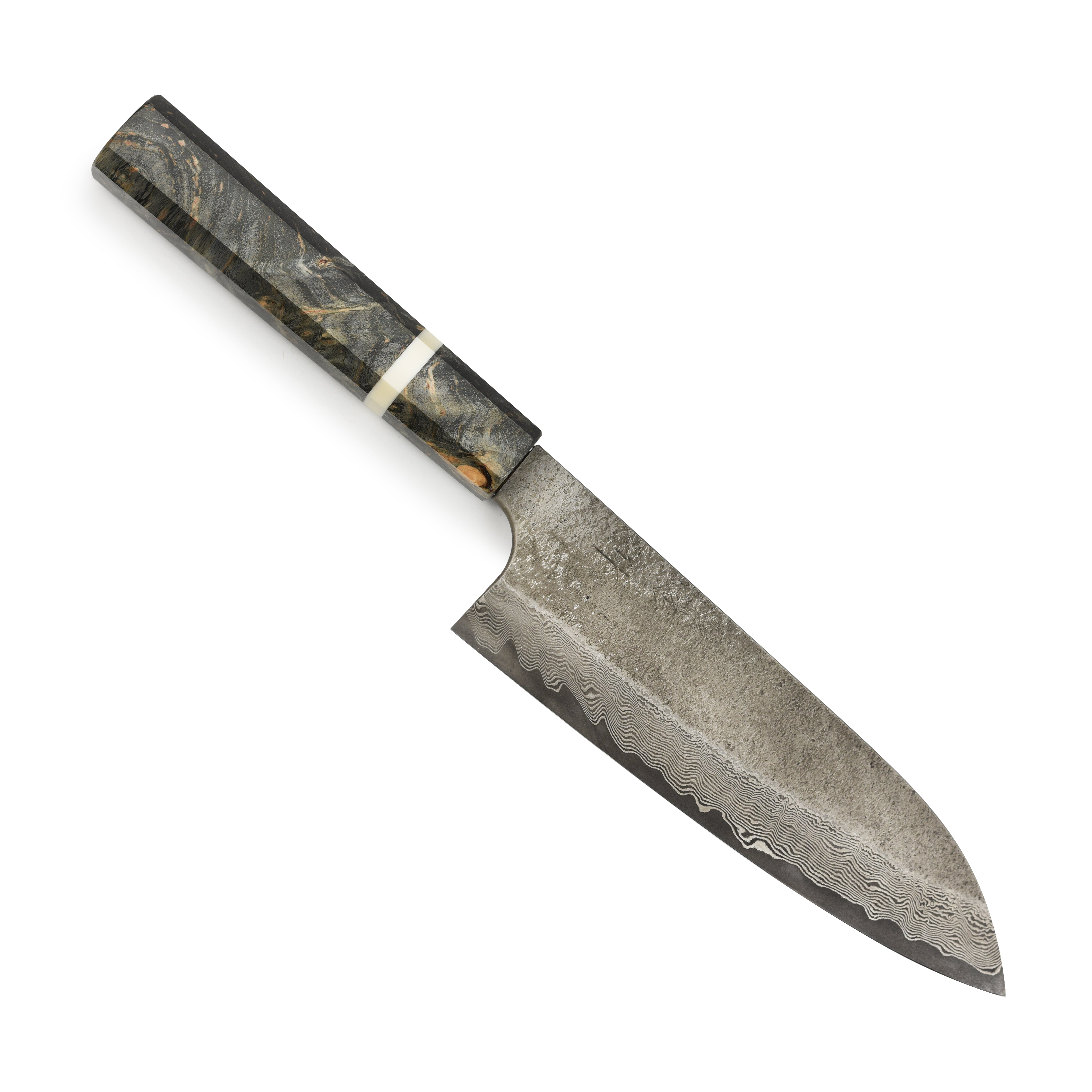 Chef using Nigara Ginsan Damascus Santoku for slicing vegetables